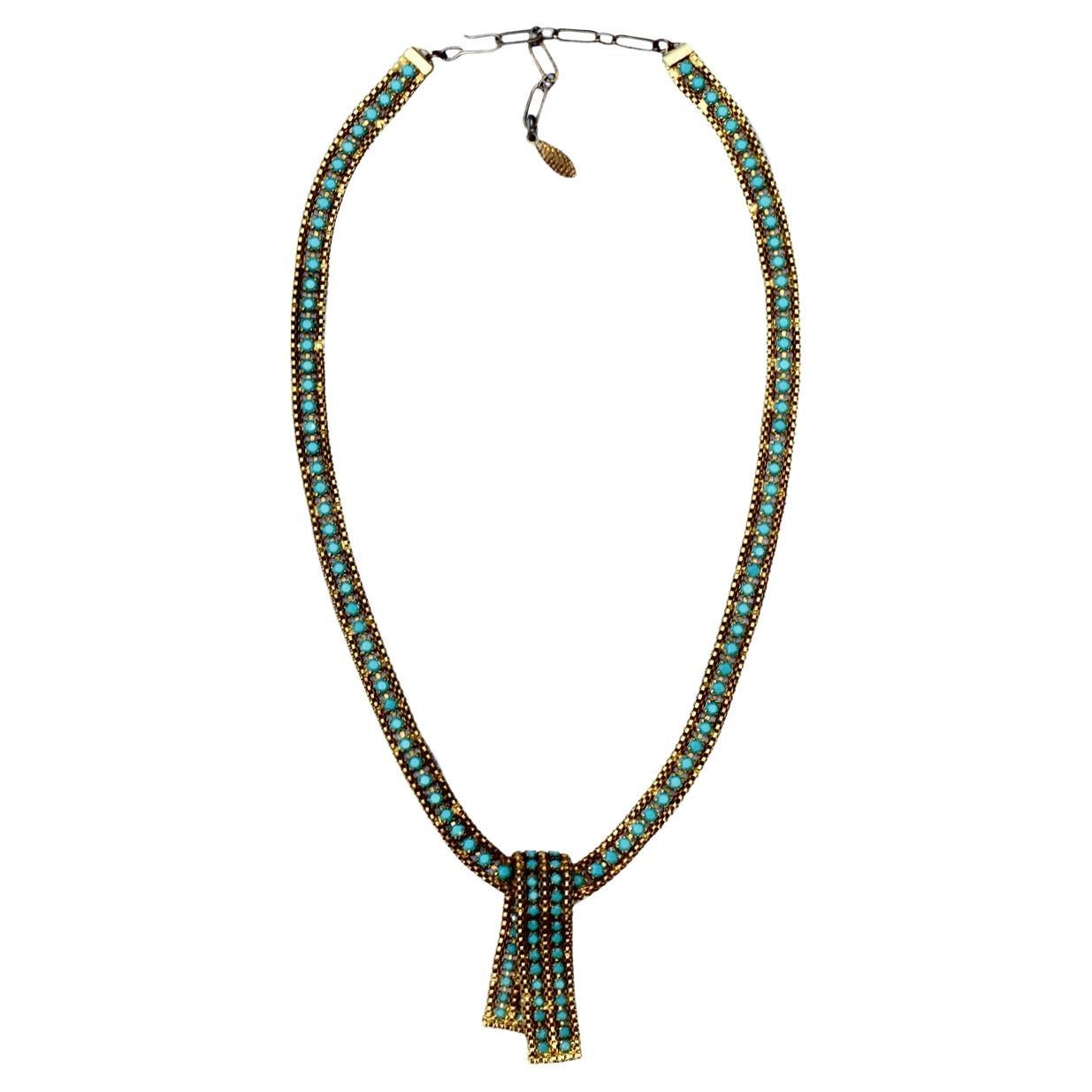 Collana in maglia placcata oro e vetro finto turchese con ciondolo a scomparsa in vendita