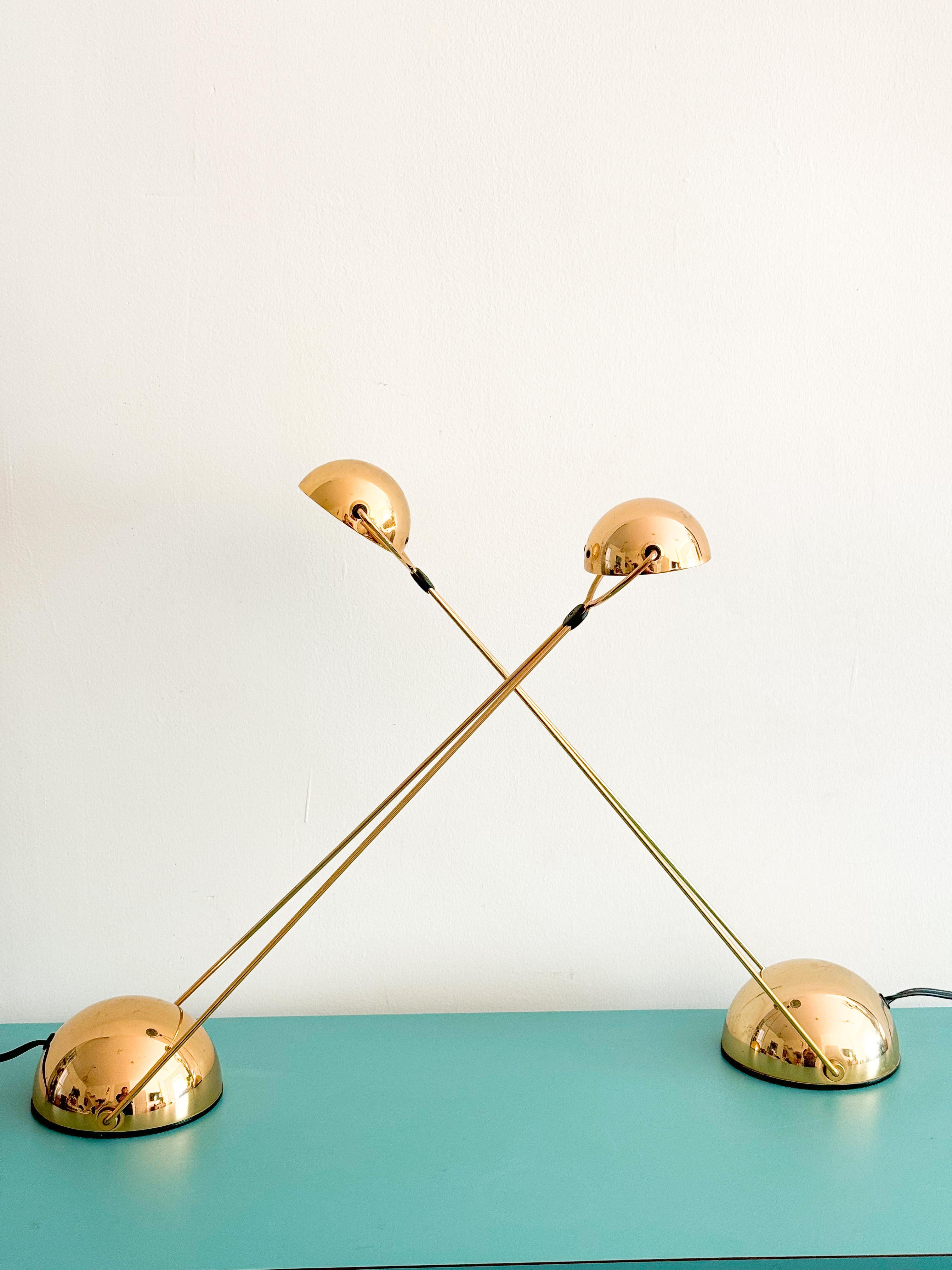 Postmodern adjustable desk lamp by Stefano Cevoli, originating from Milano, Italy, in the 1980s. 
Crafted with a striking blend of bold gold accents and sleek black elements, this lamp showcase a refined, architectural aesthetic with a modern twist.