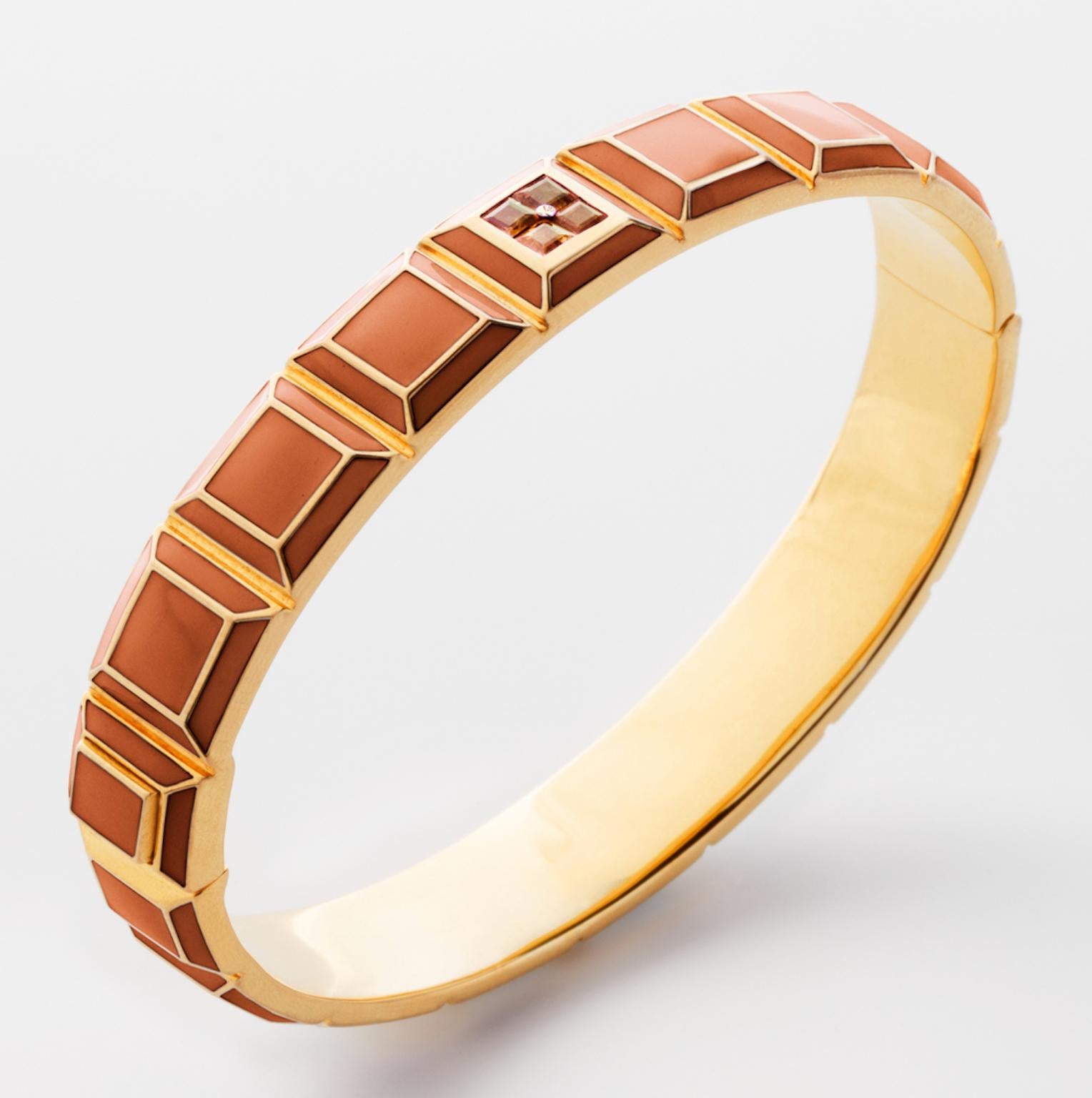 Gold-Plated Enamel Carousel Bracelet features a Yellow Gold-Plated Silver bracelet with Orange Enamel and Orange Topaz stones, along with a clasp closure that secures the bracelet onto the wearer's wrist. 
Yellow Gold-Plated Silver, Orange Enamel,