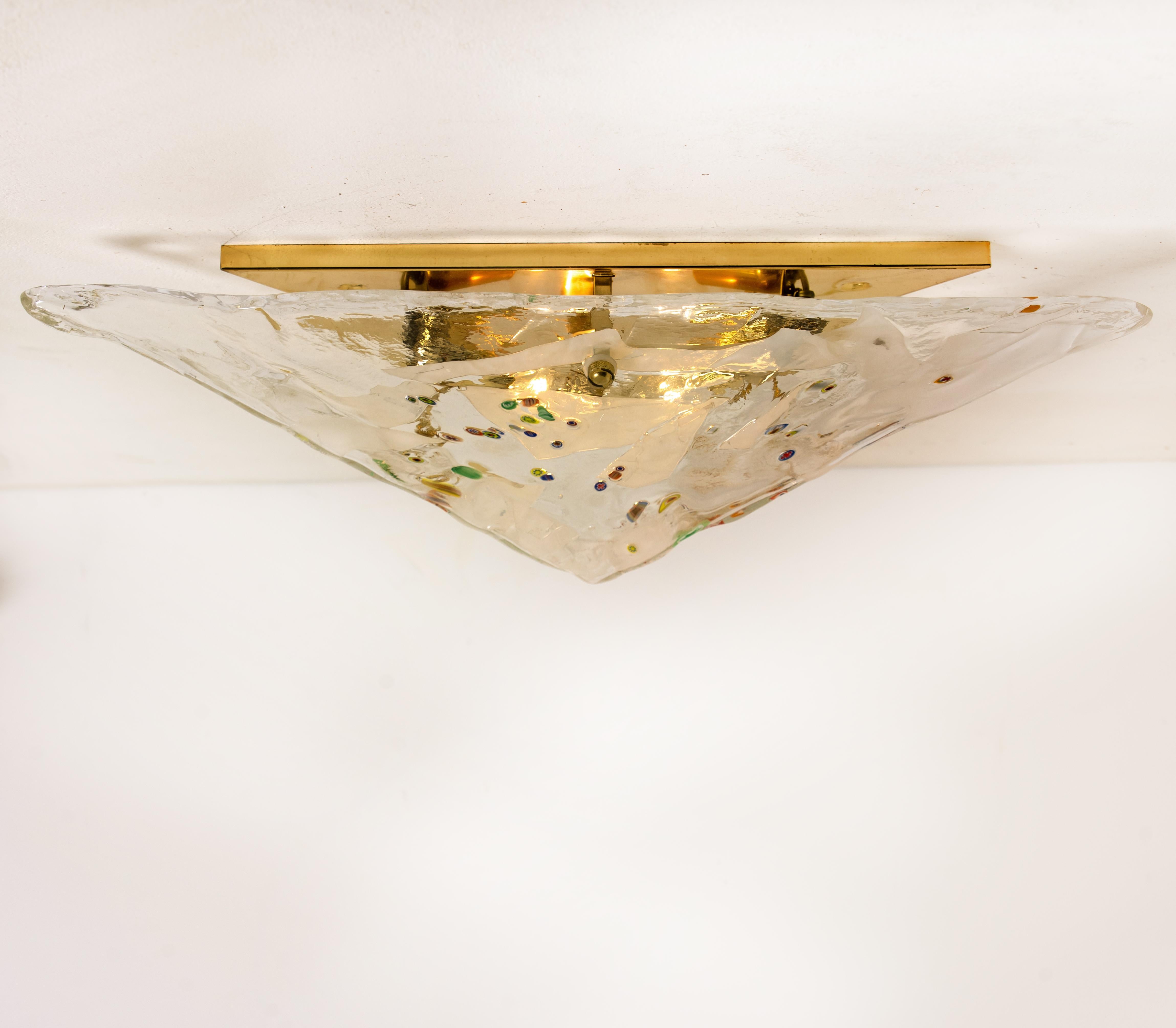 A rare gold-plated Venini flushmount with three clear opal glass shades of Murano glass. With nice colored small confetti glass drops. Modulated in the form of a pyramid. The flush mounts are designed and produced in Italy from the late 1970s. A