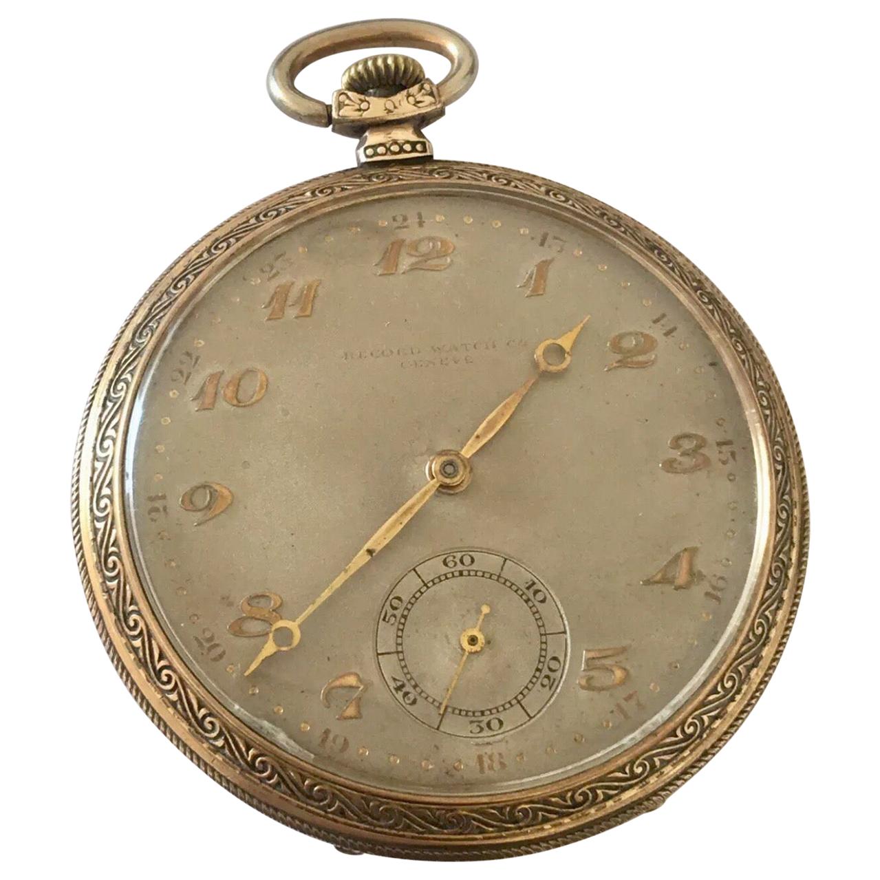 Antique Gold Plated Record Watch Co. Geneve Dress Pocket Watch.

This beautiful 51mm diameter stem-winding (keyless) dress watch is in good working condition and it is ticking well. Visible signs of ageing and wear with light surface marks on the