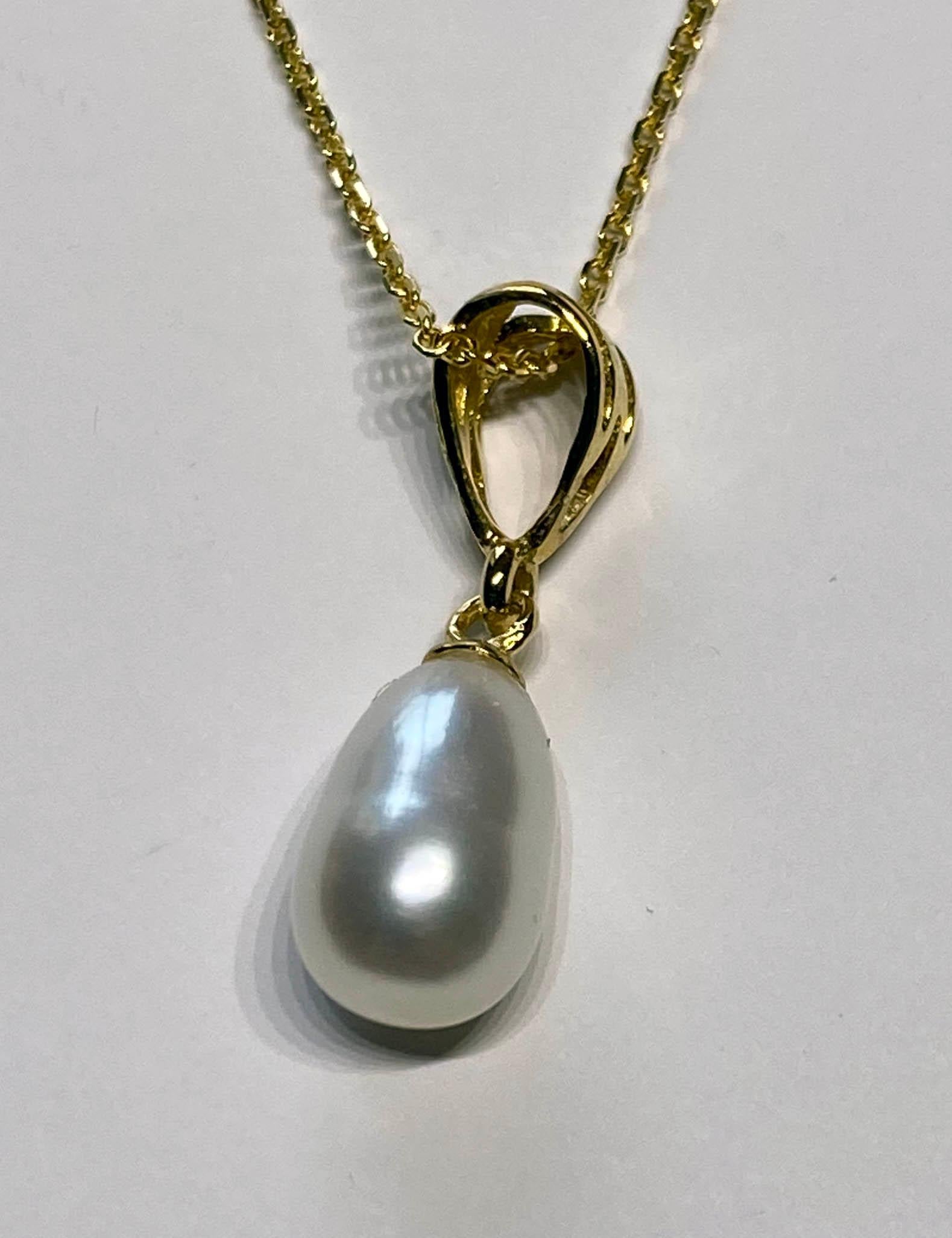 Gold Plated Silver Pendant with Freshwater a Pearl Dangle. A perfect first necklace for a young lady.

Originally from San Diego, California, Kary Adam lived in the “Gem Capital of the World” - Bangkok, Thailand, sourcing local gem stones and