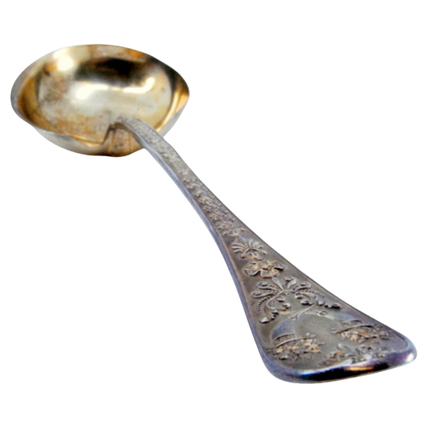 Gold-plated silver sauce spoon with raised handle and monogram card