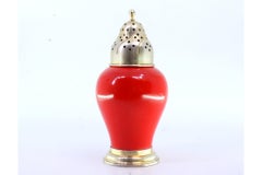 Gold-plated silver sprinkler with red porcelain structure and circular base