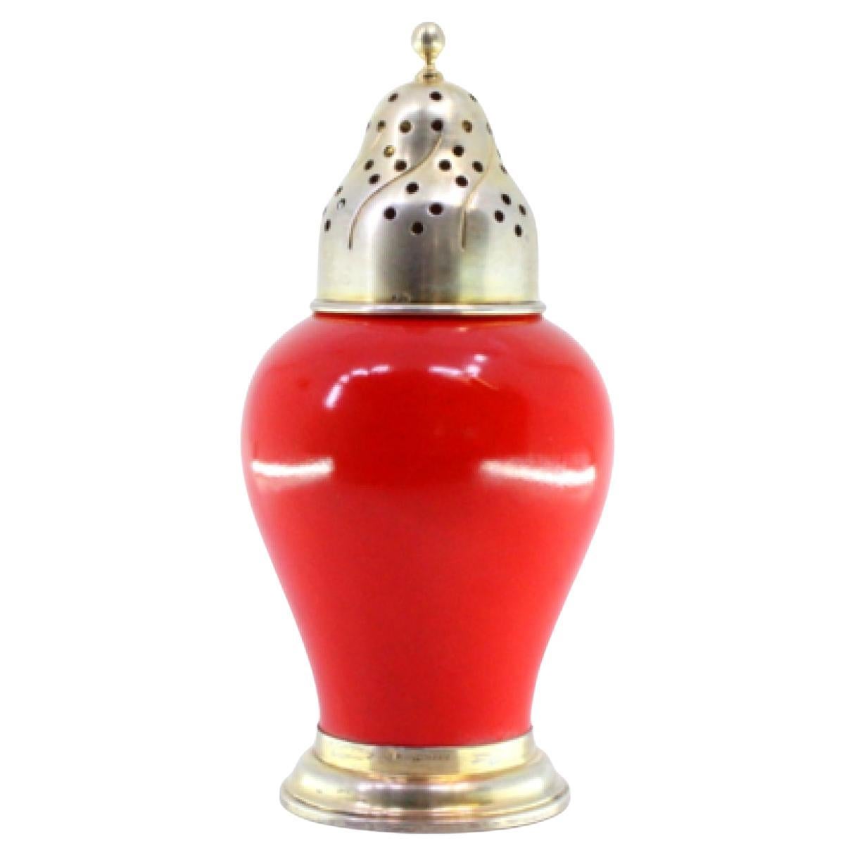 Gold-plated silver sprinkler with red porcelain structure and circular base