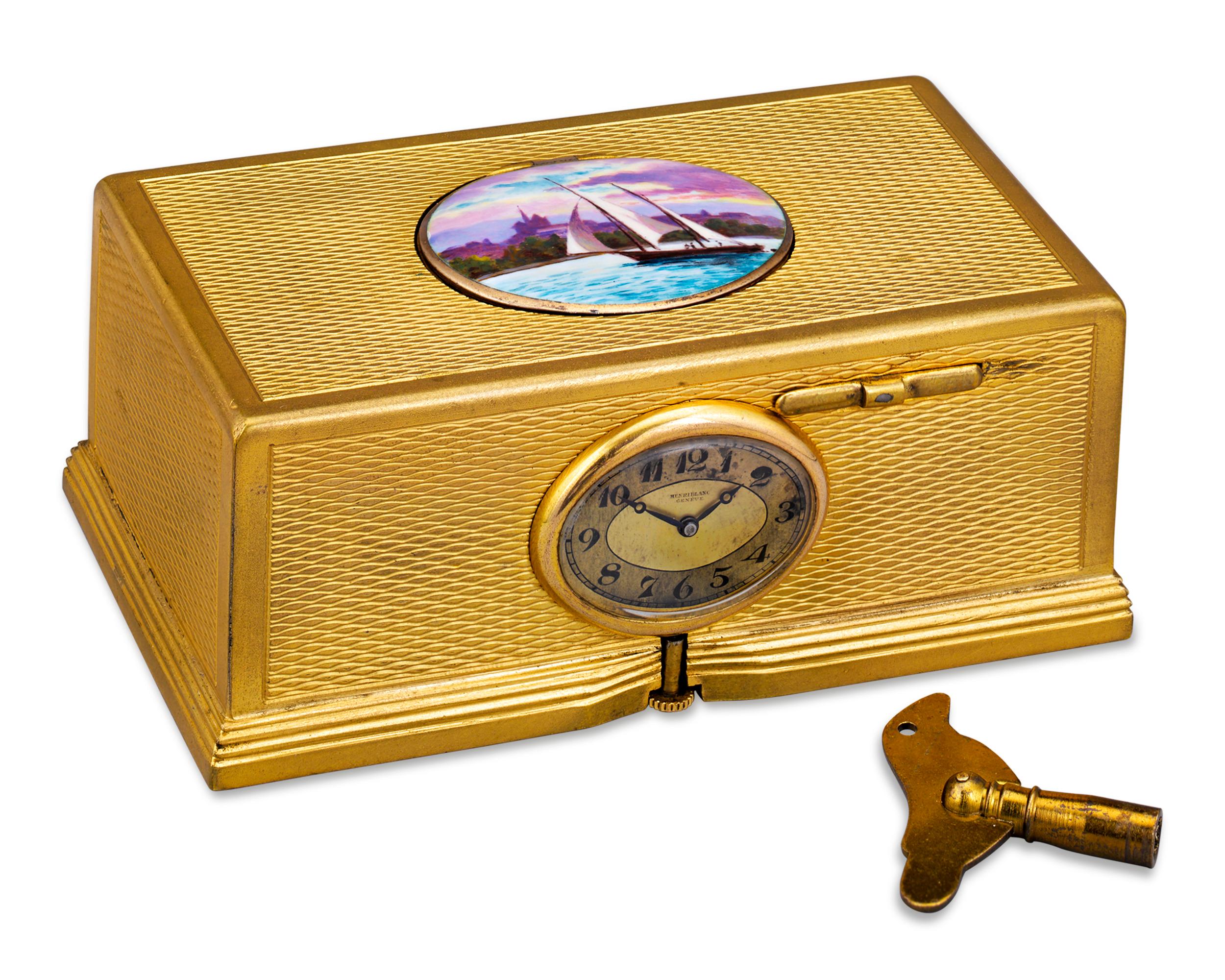 Combining a diminutive clock and a charming automaton, this Swiss bird box is a mechanical work of art. Enveloped in an intricately engraved gold-plated case, its complex mechanism springs to life with the simple press of a button. When activated,
