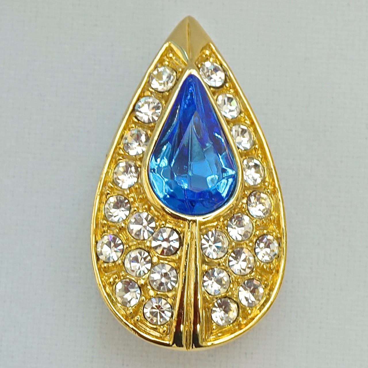 
Fabulous gold plated tear drop clip on earrings, set with lovely azure blue glass stones and clear faceted crystals. Measuring length 3cm / 1.1 inch by width 1.7cm / .67 inch. The earrings are in very good condition. Circa 1980s.

These beautiful