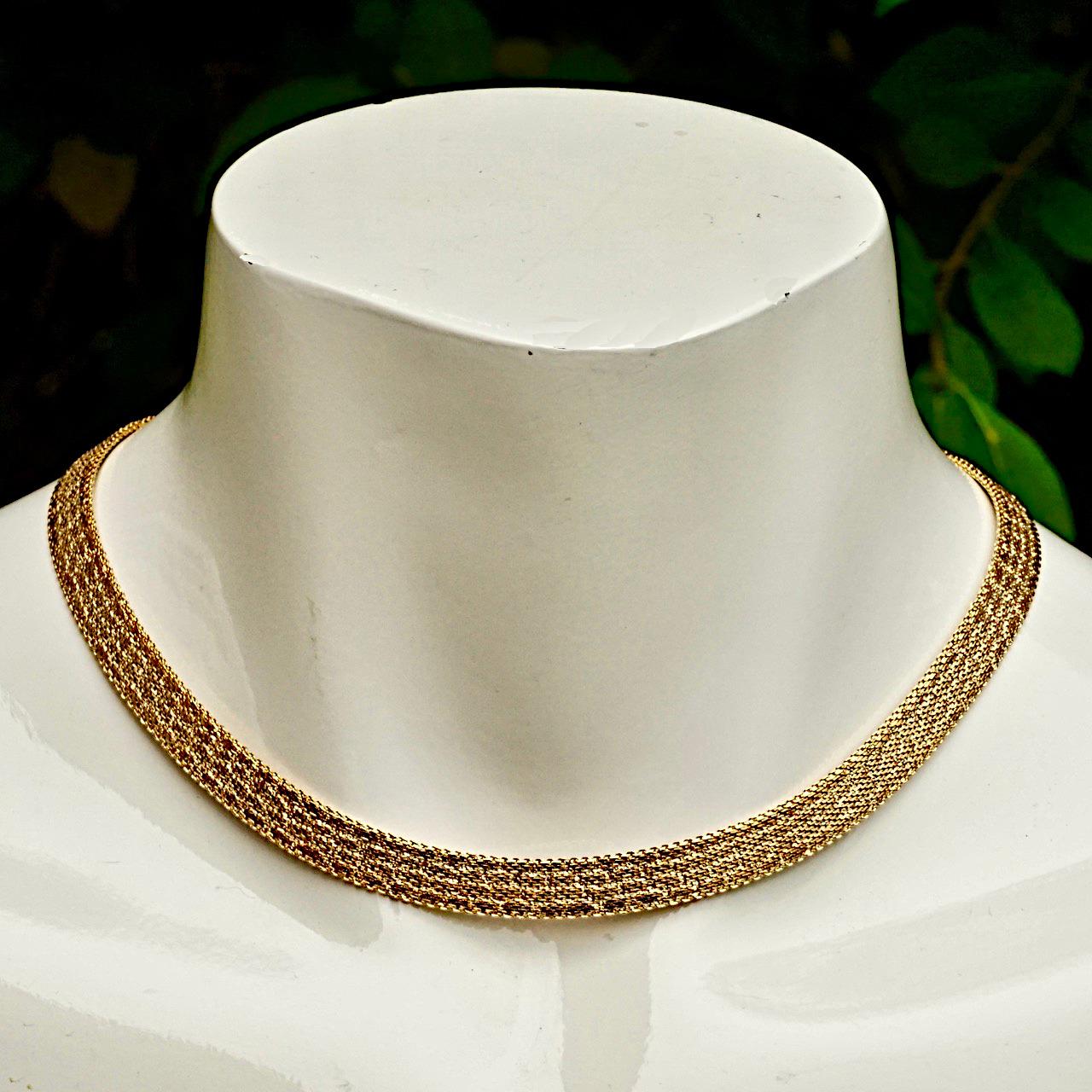 Beautiful bright gold plated mesh necklace, featuring a lovely textured design, and safety chain. Measuring length approximately 39.6cm / 15.6 inches by width 8 mm / .3 inch. The necklace is in very good condition, as new.

This is a stylish collar