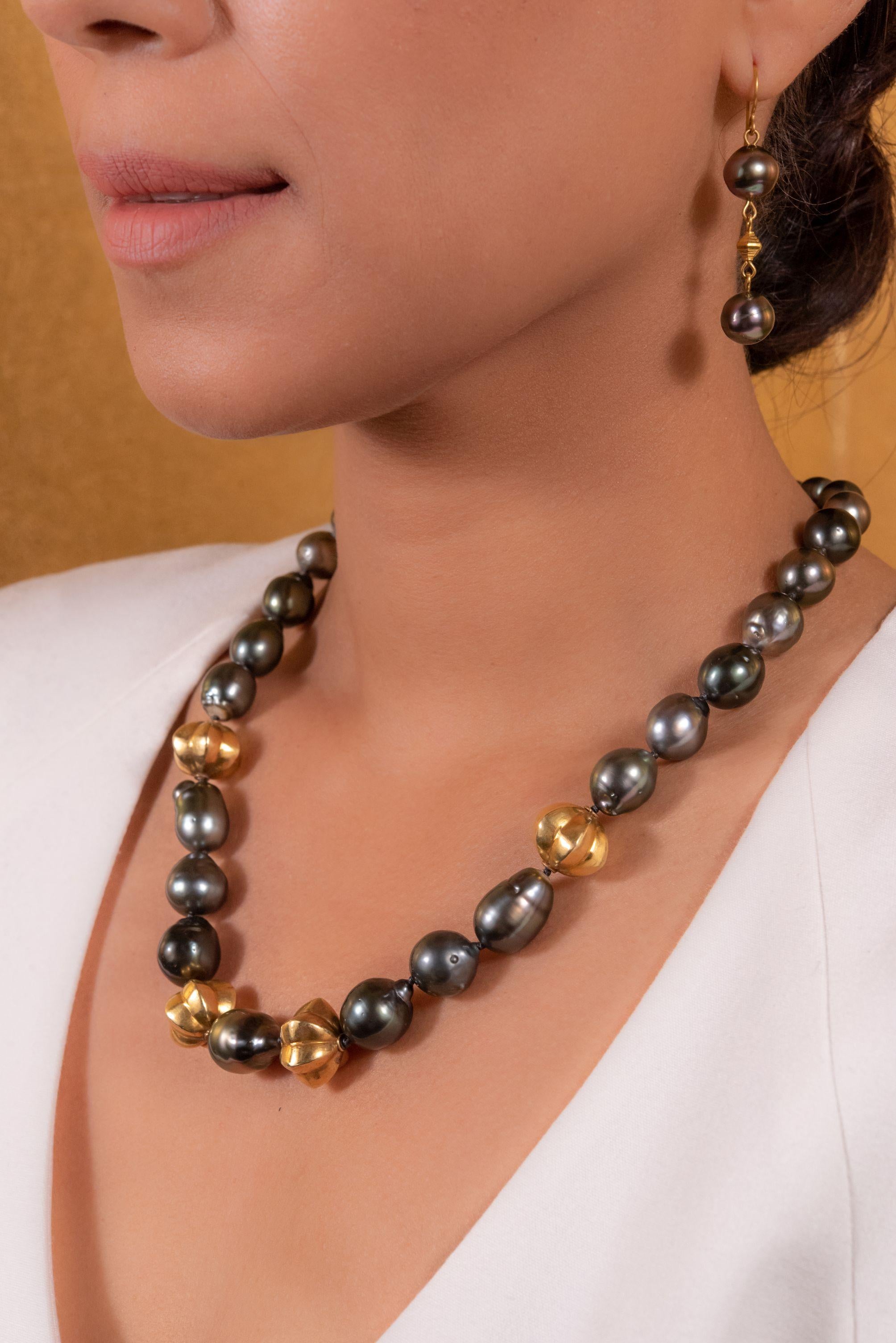 Star fruit and pearls collide for unmatched tropical elegance. Our stunning star fruit necklace features luxurious, glossy black Tahitian pearls interspersed with vintage gold-plated Sumatran beads, taking you to a tropical island no matter where
