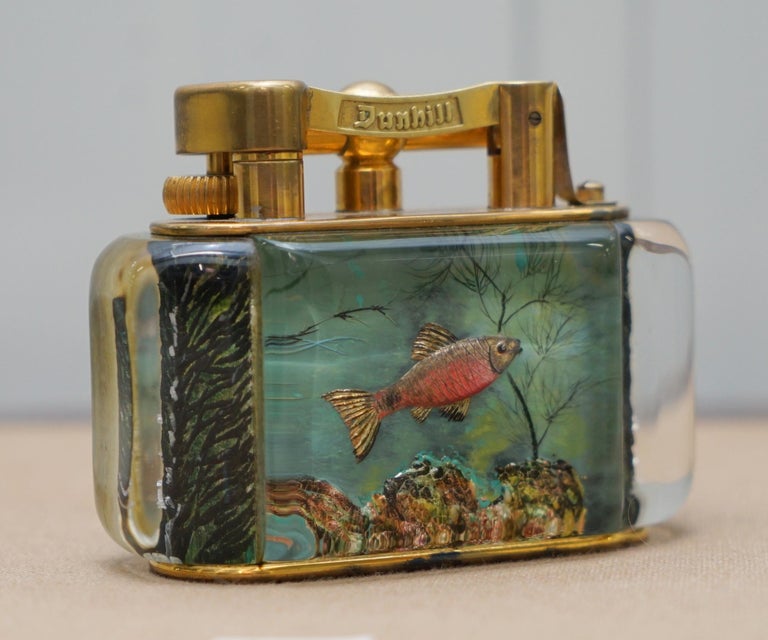 We are delighted to offer for sale is this very rare original 1950s hand made in England oversized Dunhill Aquarium table lighter with gold-plated metal work as used by Winston Churchill 

They are all exceptionally rare, each piece is a one off