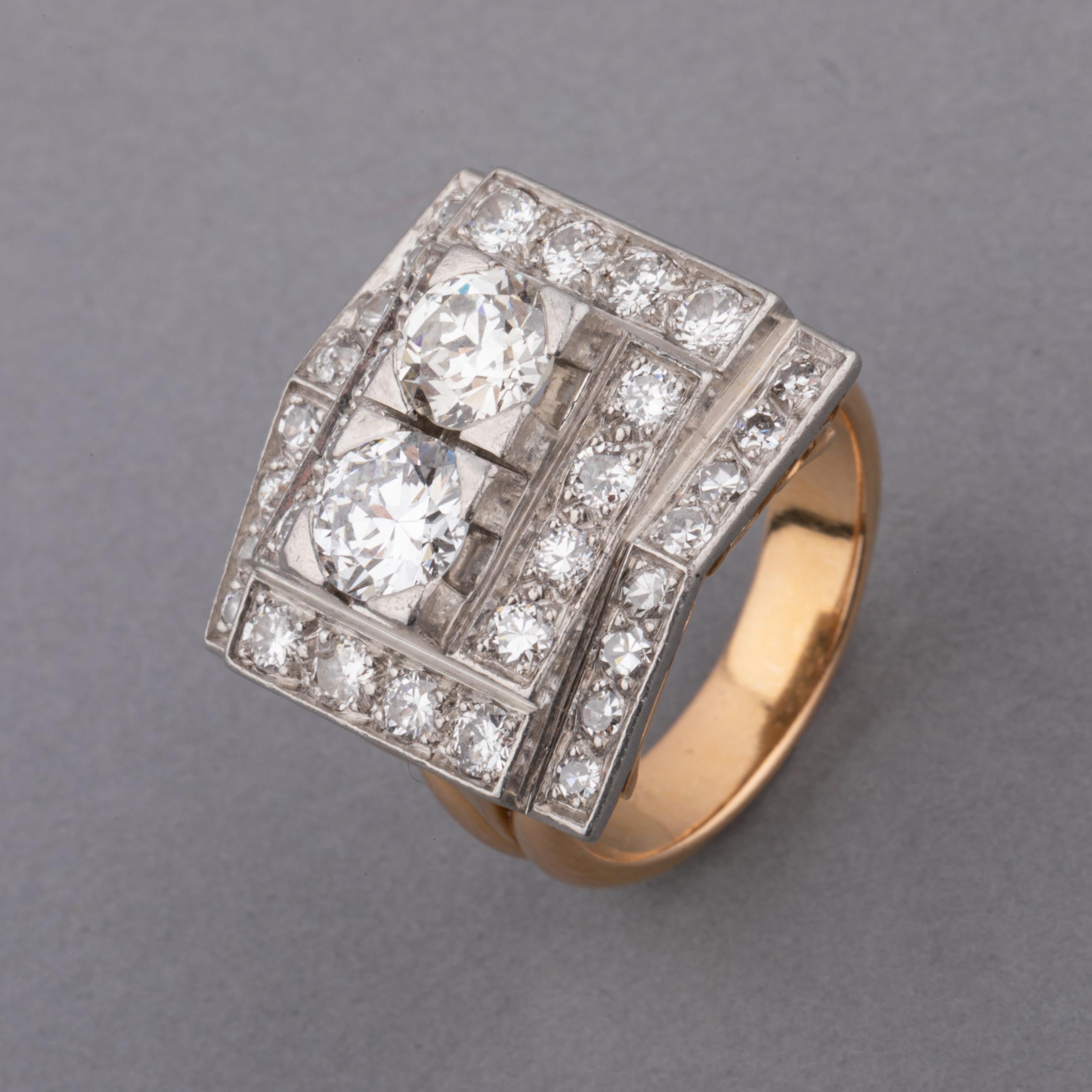 A very lovely retro ring, made in France circa 1940.
Made in platinum and 18k gold. The two principal round cut diamonds weights 0.70 carats each. 3 carats total.
French Hallmarks for platinum and gold.
The dimension of front part is 18*17mm.
Ring