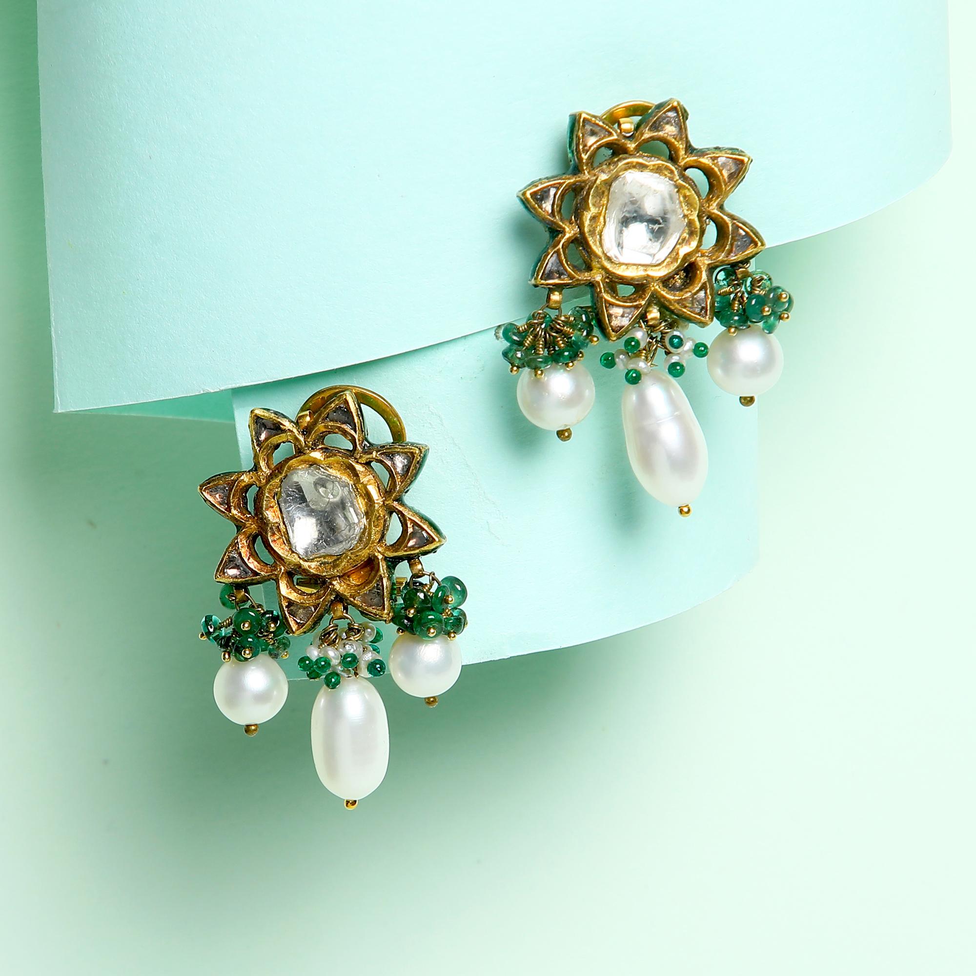 Polki Diamond, Emerald Beads and Droplet Pearls in a Stud Meets Jhumkas Style. 