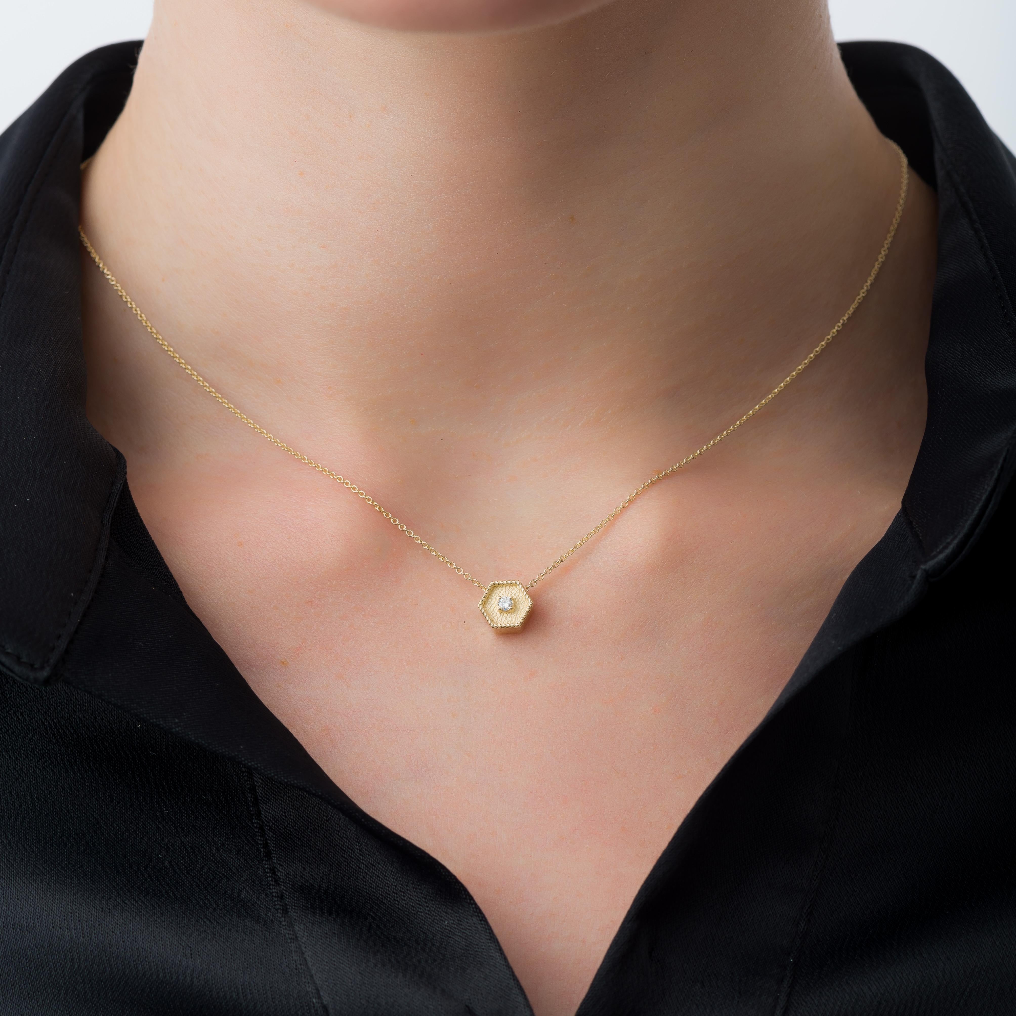 Elevate your style with our gold polygon pendant, featuring a mesmerizing diamond that adds a touch of timeless brilliance to your look.

100% handmade in our workshop.

Metal: 18K Gold
Gemstones: Diamond  weight 0,05 ct

Every pendant is