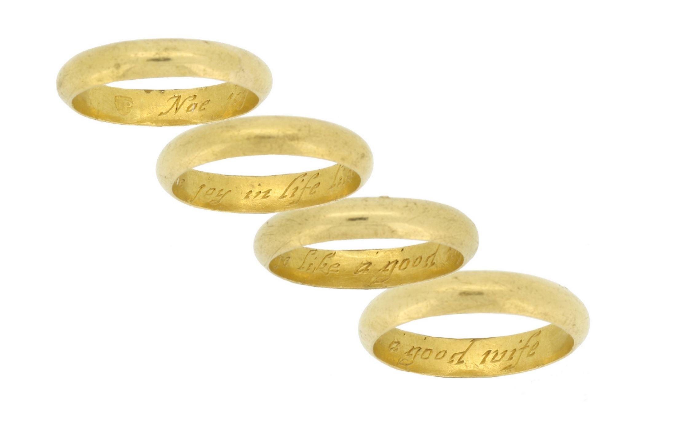 Gold posy ring 'Noe joy in life like a good wife'. The smooth plain D-shape band engraved to the interior in italic script 'Noe joy in life like a good wife', approximately 4.2mm in width. Tested yellow gold, maker's mark 'DP' within a shield,