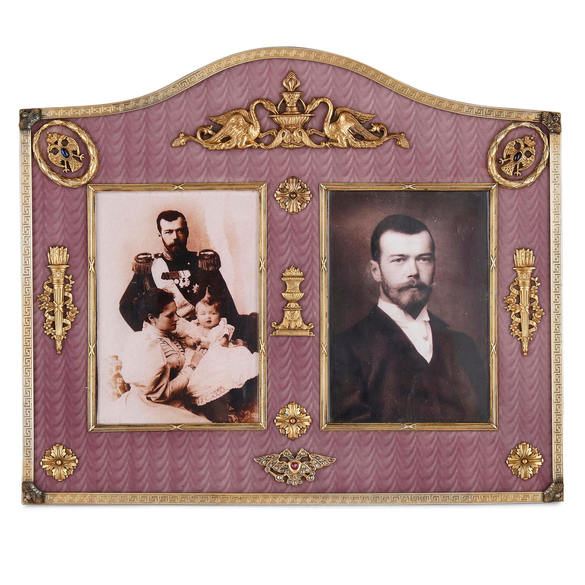 This double picture frame is designed in the style of Fabergé. The frame is rectangular in profile with a central protruding round crown. The surface of the frame is profusely ornamented with guilloché enamel in luxurious purple, the interior and