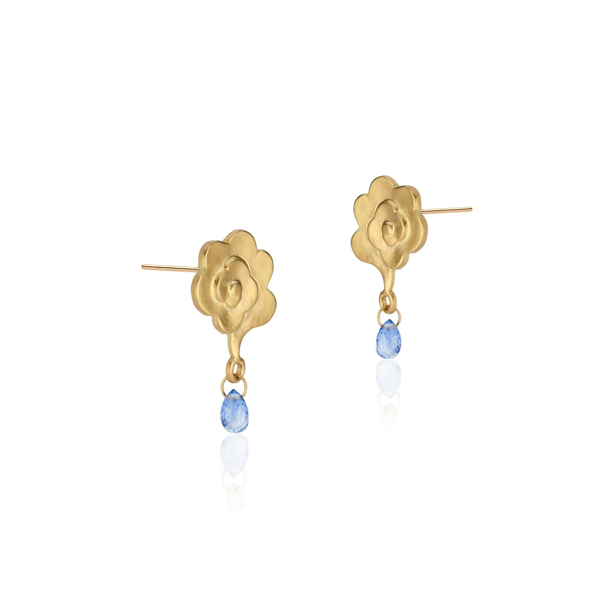 Blue sapphire raindrops dangle from 18k matte rain cloud earrings. Handcrafted by Susan Mancuso of Forge & Foundry Jewels.

Into each life, some rain must fall. And that can be a good thing.