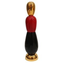 Totem Oro Rojo Negro Diseñado por Alessandro Mendini. Italia