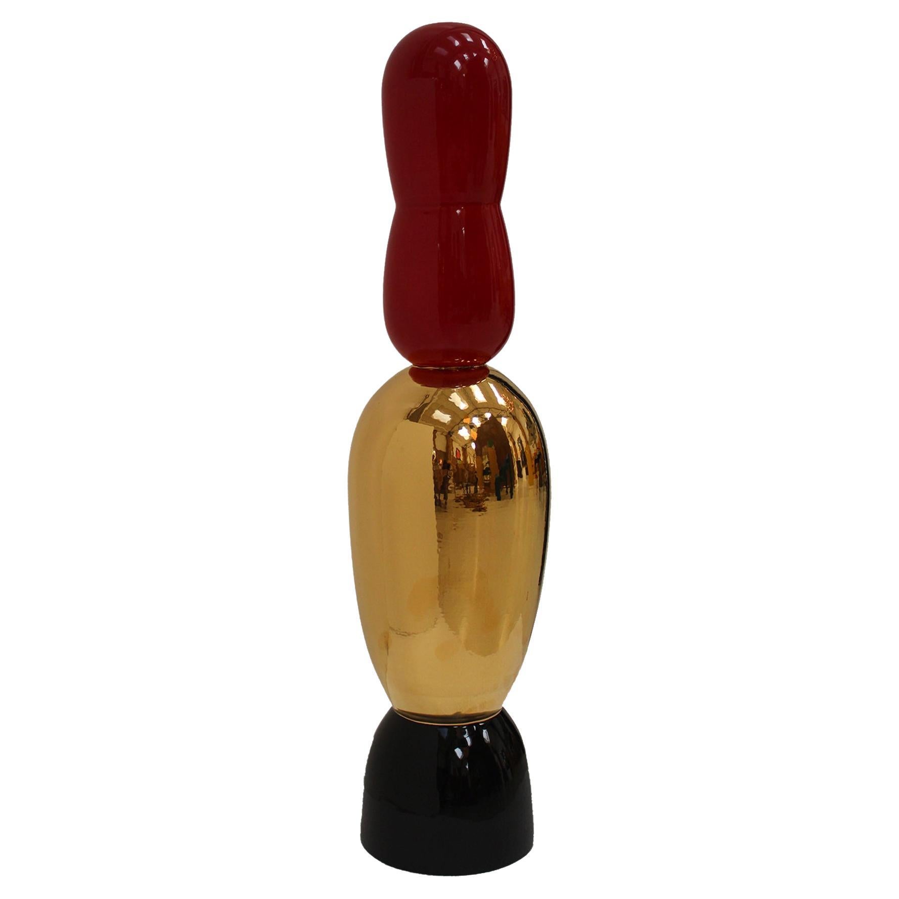 Totem Oro Rojo Negro Diseñado por Alessandro Mendini. Italia