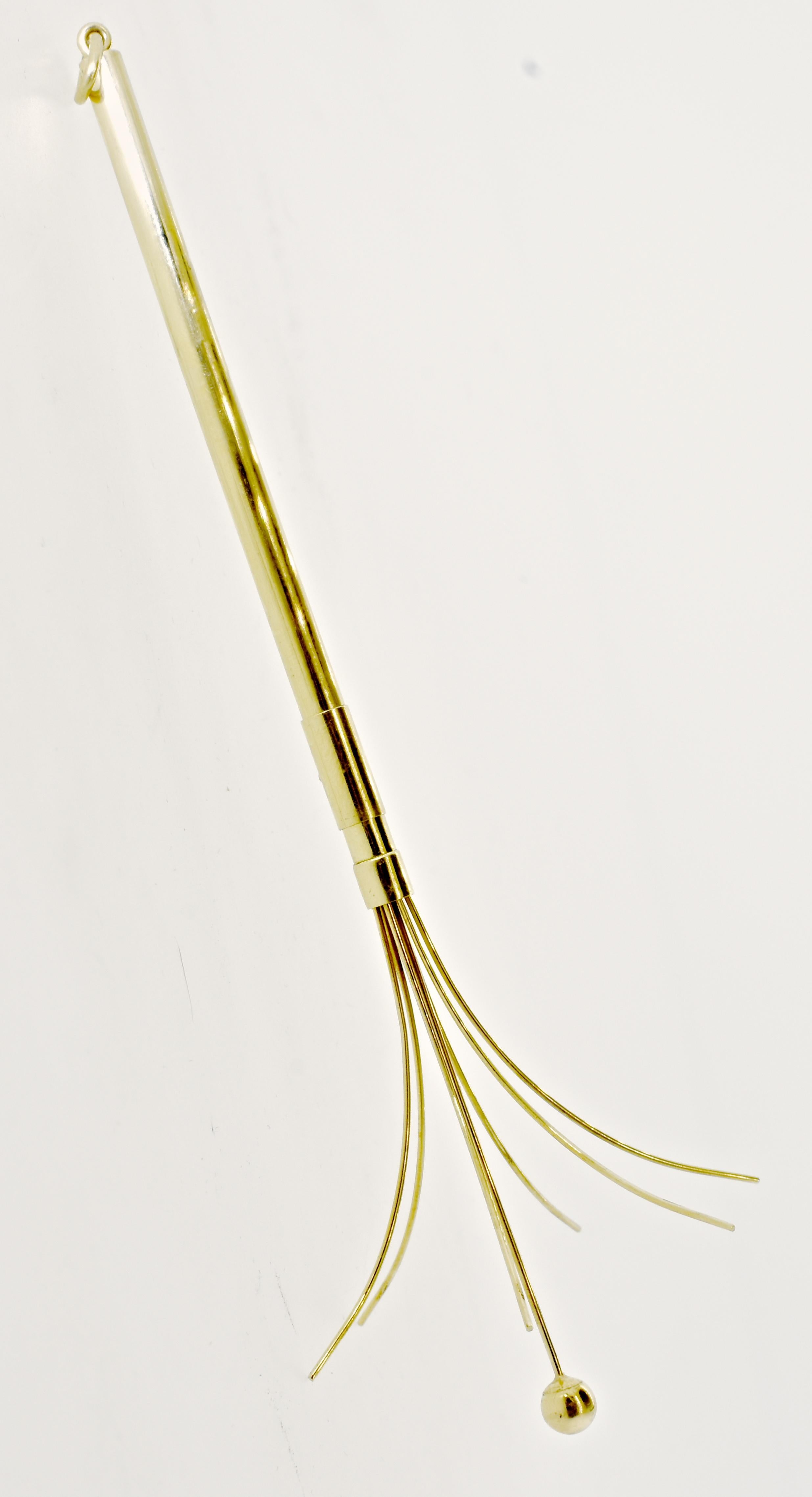 Gold vintage swizzle stick, this vintage piece is 3.5 inches long when closed and 5.5 inches long when opened.  A perfect gift for someone, and an unusual piece to have in one's possession when cocktails are brought out!.  There is a pendant loop on