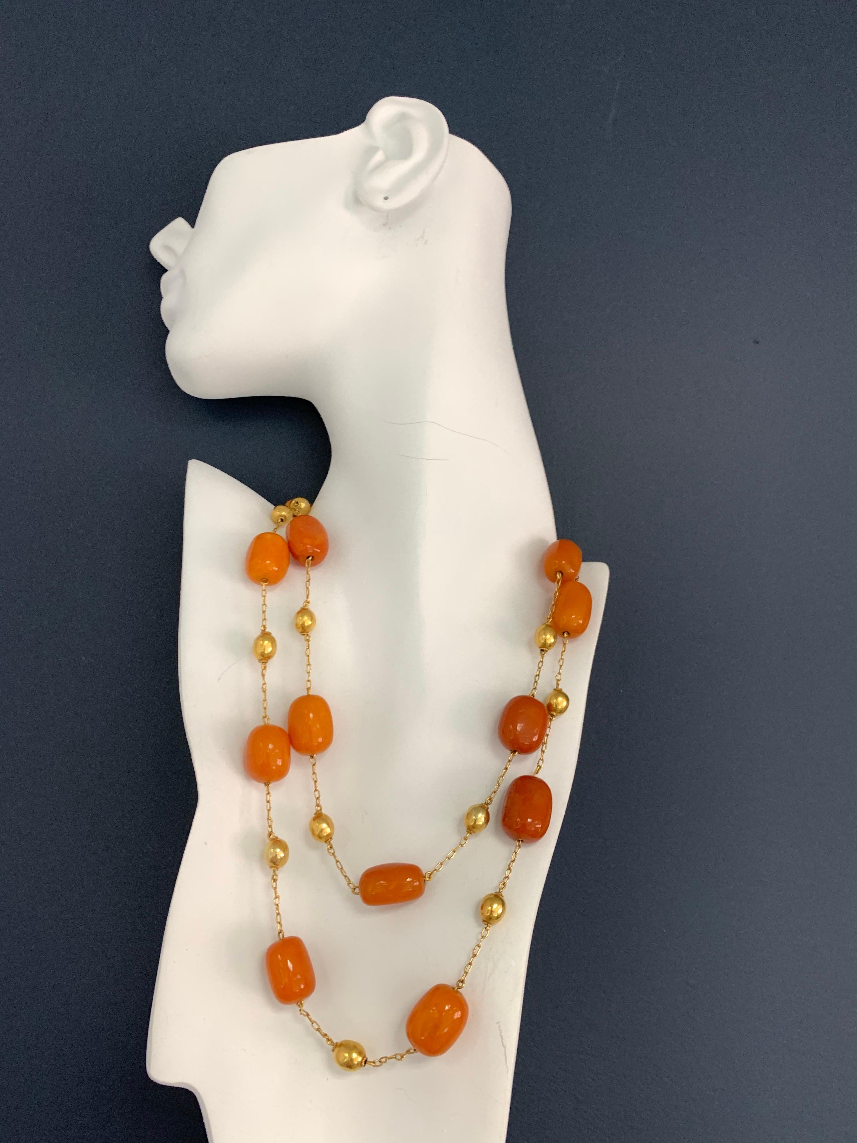 Vintage Natural Baltic Butterscotch Egg Yolk Reconstructed Amber and Gold Bead Necklace, circa 1950. 

The total weight is 73.9 grams, and each amber bead measures approximately 0.75-1