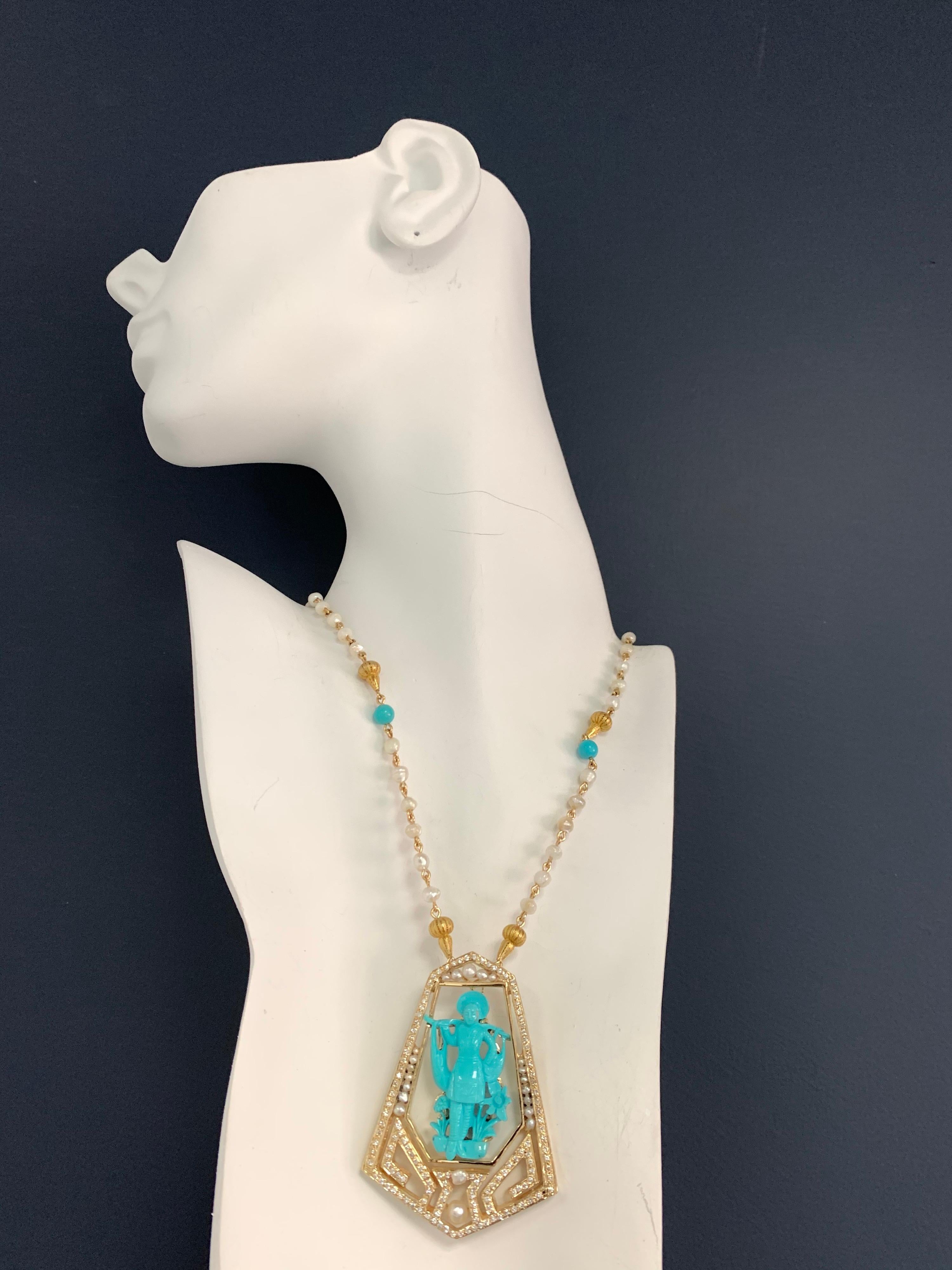 A Stunning 14k Yellow Gold Chinese Vintage Pendant, set with a Natural Hand Carved Turquoise and 134 Natural Round Brilliant Diamonds weighing approximately 1.25 carats (G in color and VS in clarity). 

The piece is set with Natural South Sea Pearls