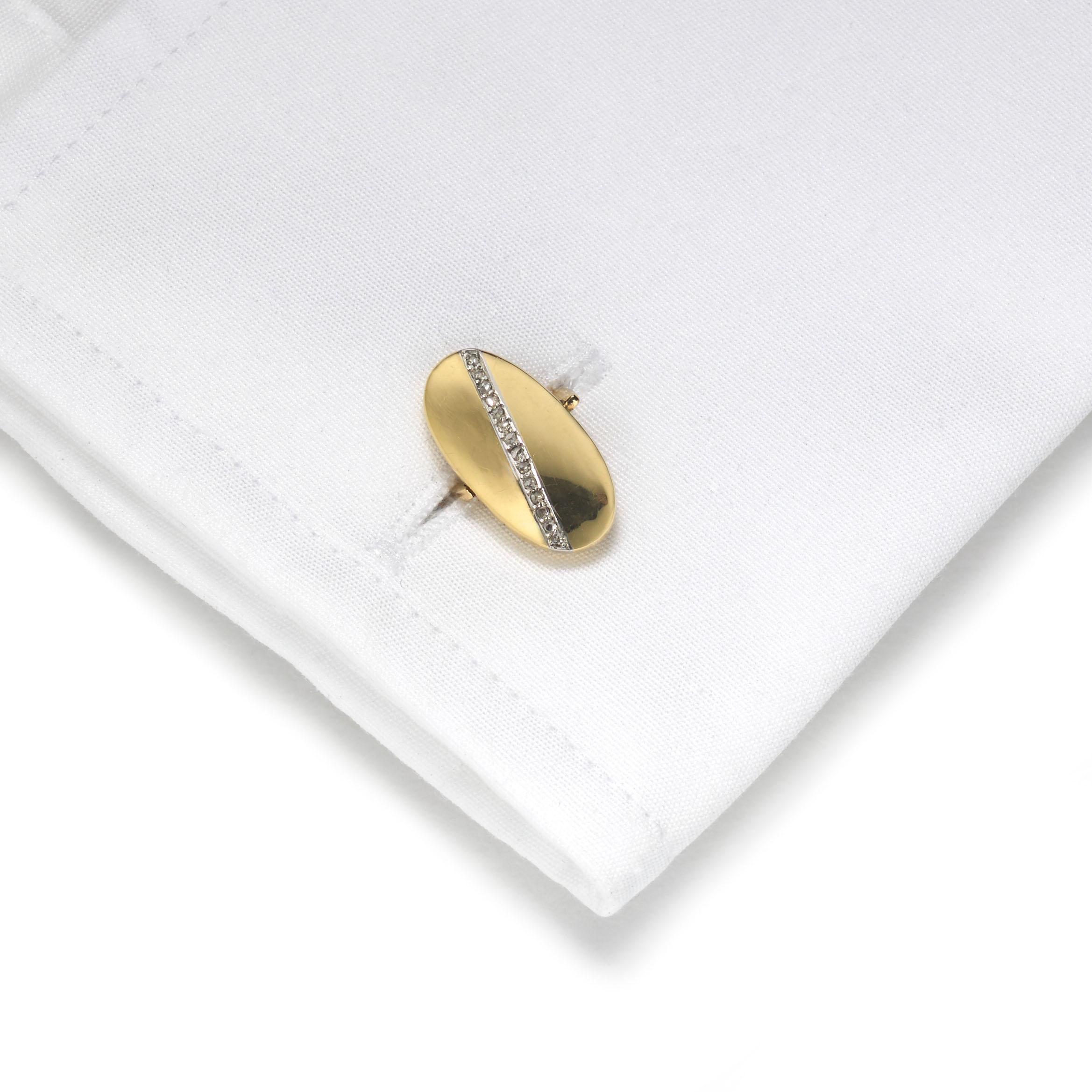 A pair of reversible gold cufflinks, set with a line of rose-cut diamonds, in grain settings, on oval, convex, hollow work heads, with solid swivel links, marked RGD 14856, 750, with French weevil marks, for 18ct gold imported into France, circa