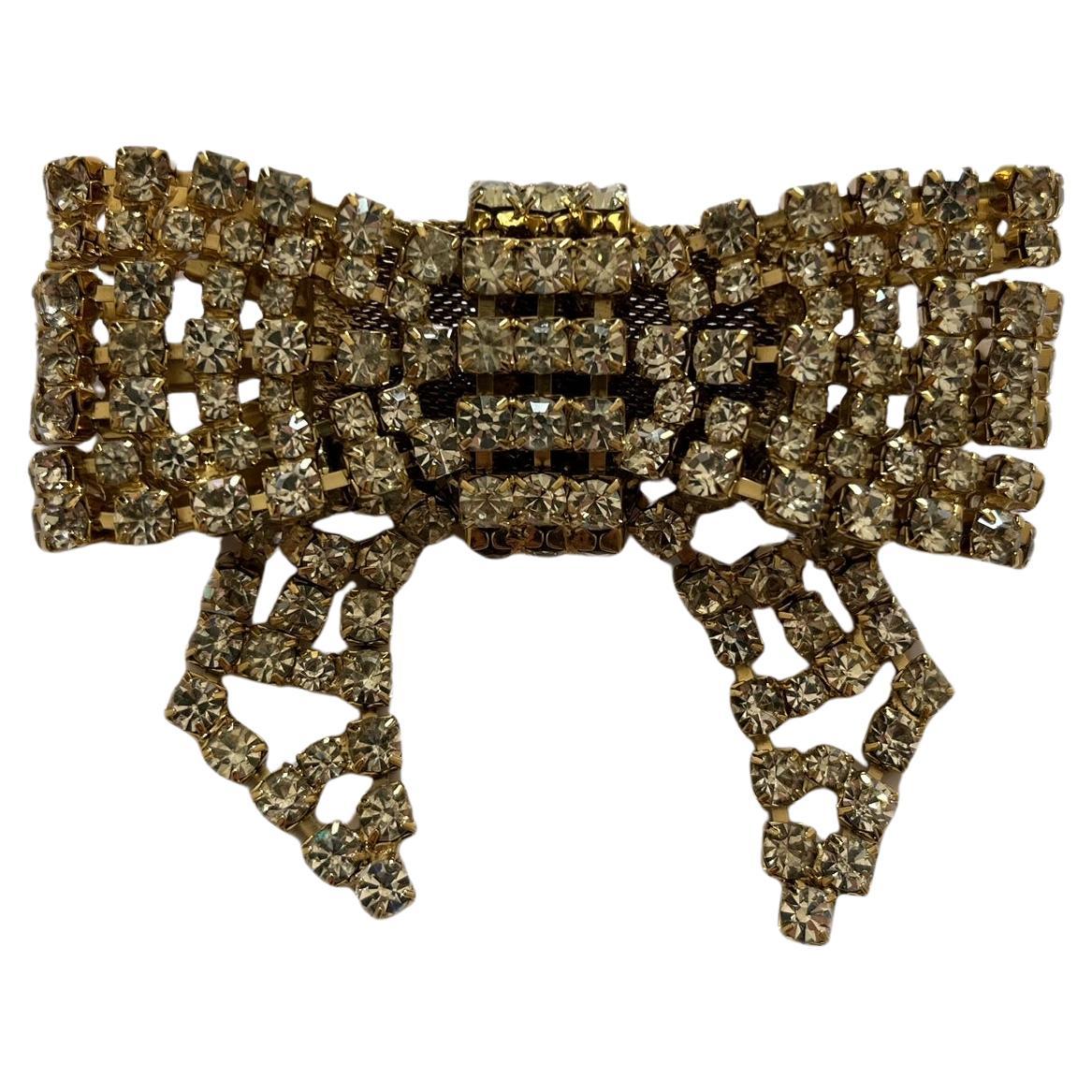 Gold Rhinstoned Bow Brooch by Daniel Swarovski For Sale