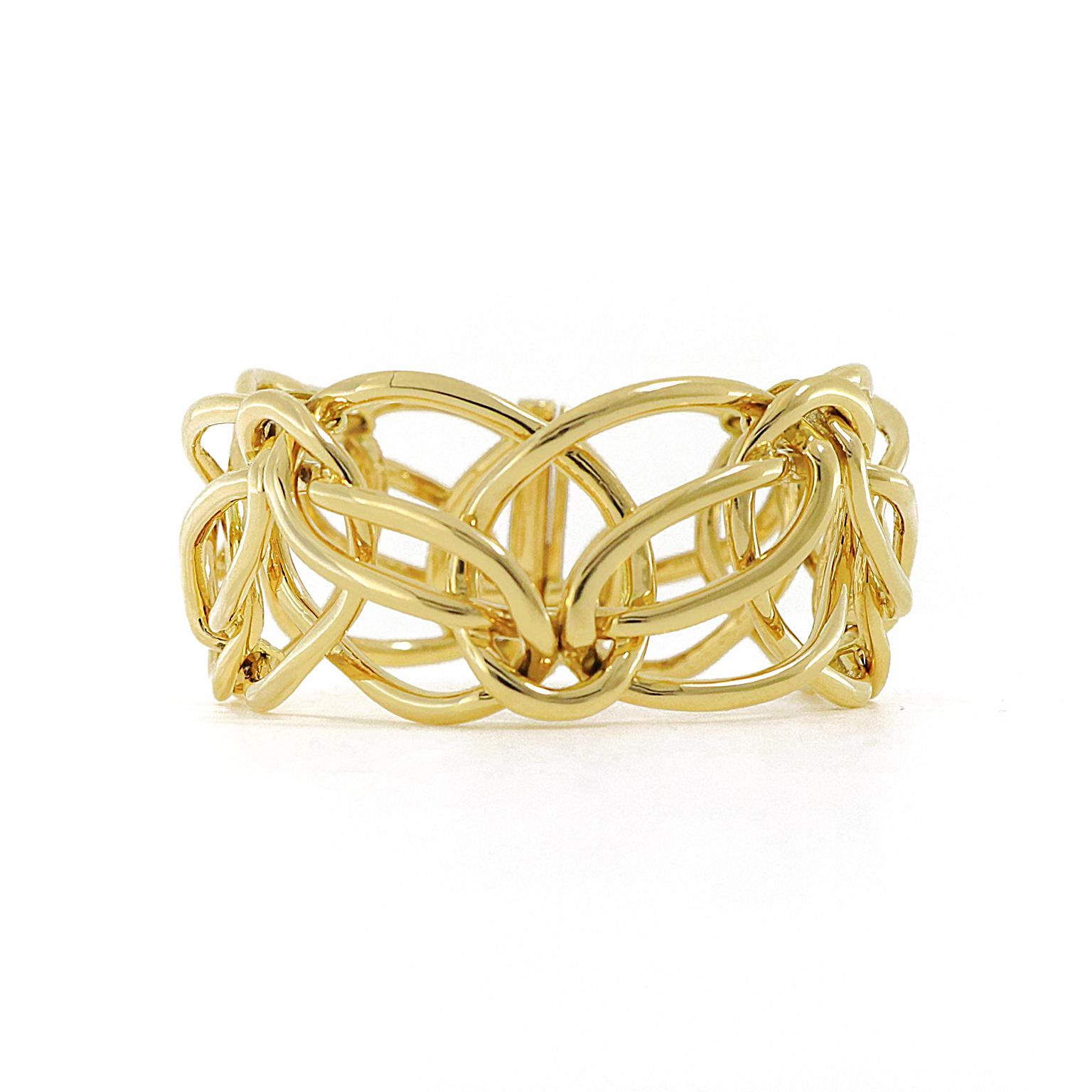 Radiant 18k yellow gold wreathes in an intricate design reminiscent of ribbons. The polished metal reflects light in every direction as the wrist turns. A bar clasp closes the bracelet, which measures 1.19 inches (width) by 0.28 inches (depth) by