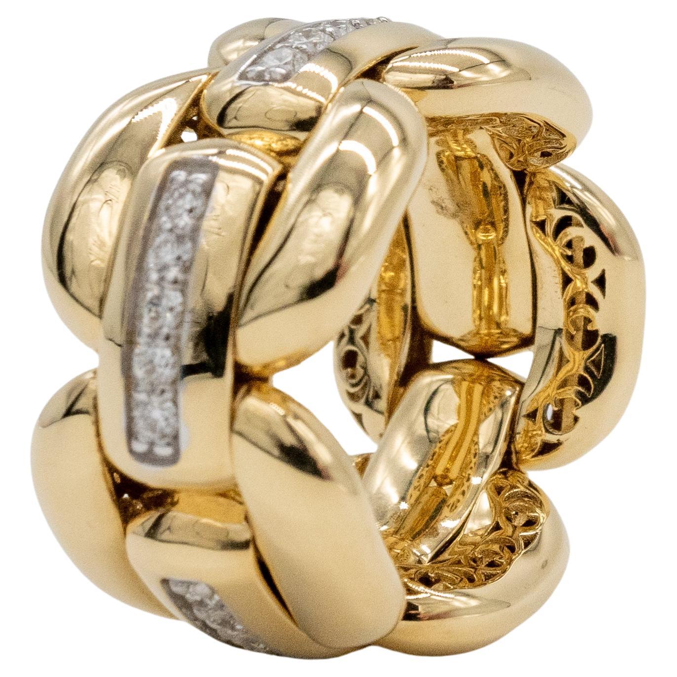 Gold Ring and Articulated Diamonds
we love the ease of use of this articulated ring.
it's flexible in size and can be worn on different fingers.
it is in 18-carat yellow gold and weighs 15.20 grams
 of gold. it is set with 0.55 carat Gvs diamonds.