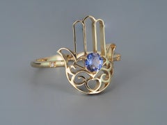 Gold Ring "Hamsa" Hand with Tanzanite in the Center and Diamonds