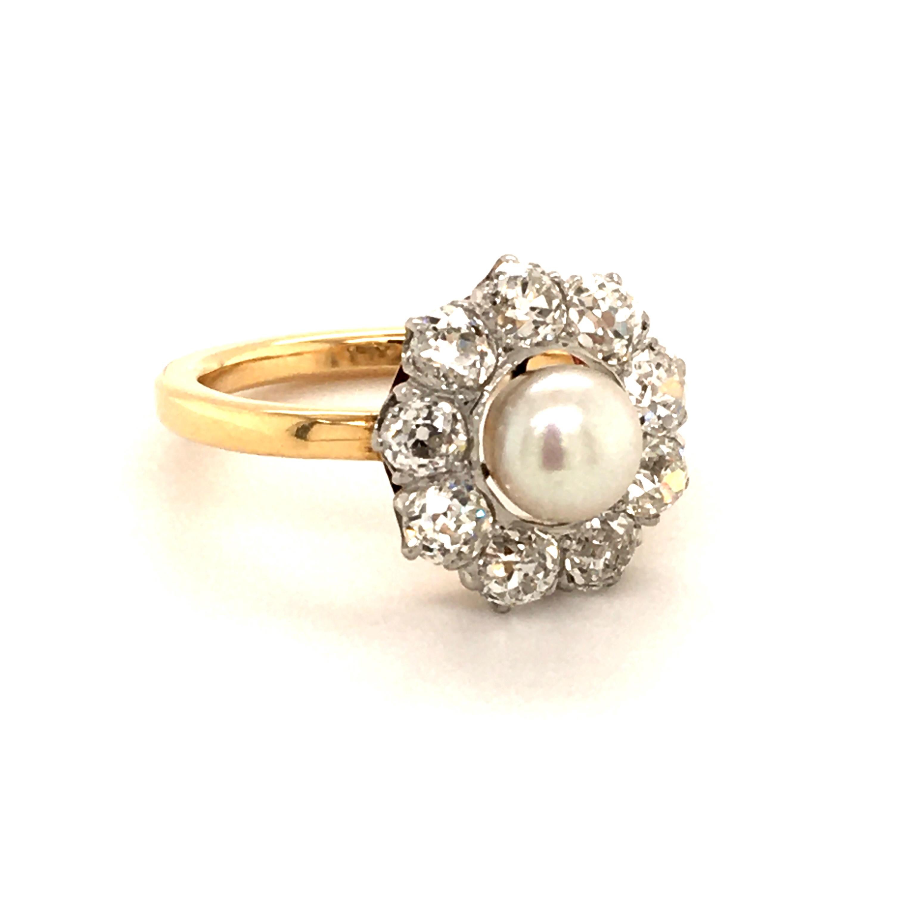 pearl ring surrounded by diamonds