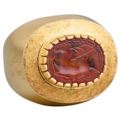 Gold Ring Set with an Ancient Carnelian Scarab Depicting a Deer Hunt.