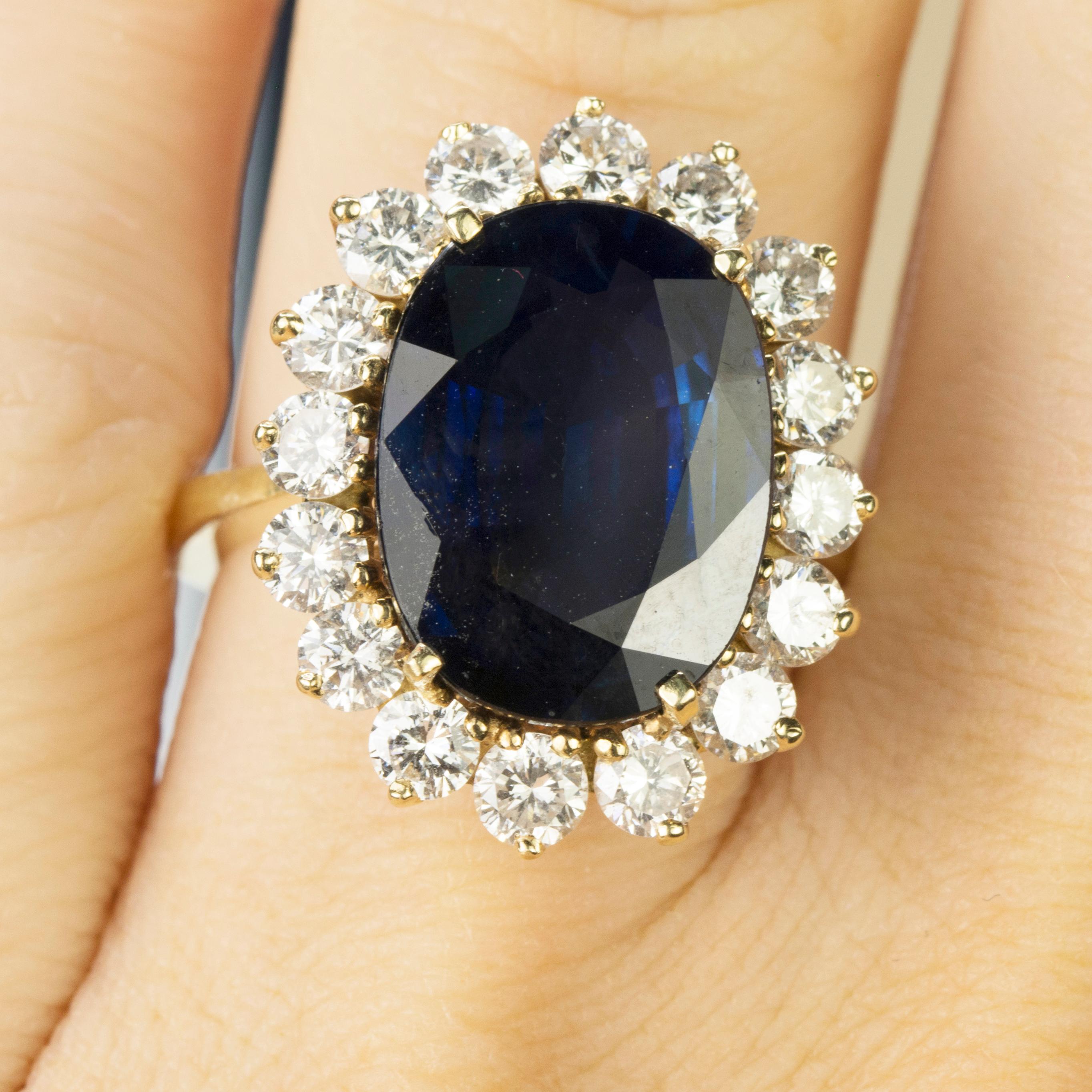 14k Ring with AGL certified 8.86 carat oval blue sapphire and 16 round diamonds weighing approximately 2.40 carats. 7.42g