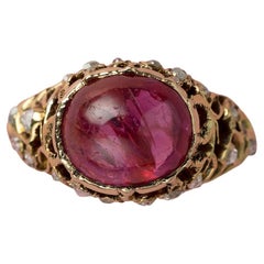 Gold Ring with a Pink Sapphire and Diamonds
