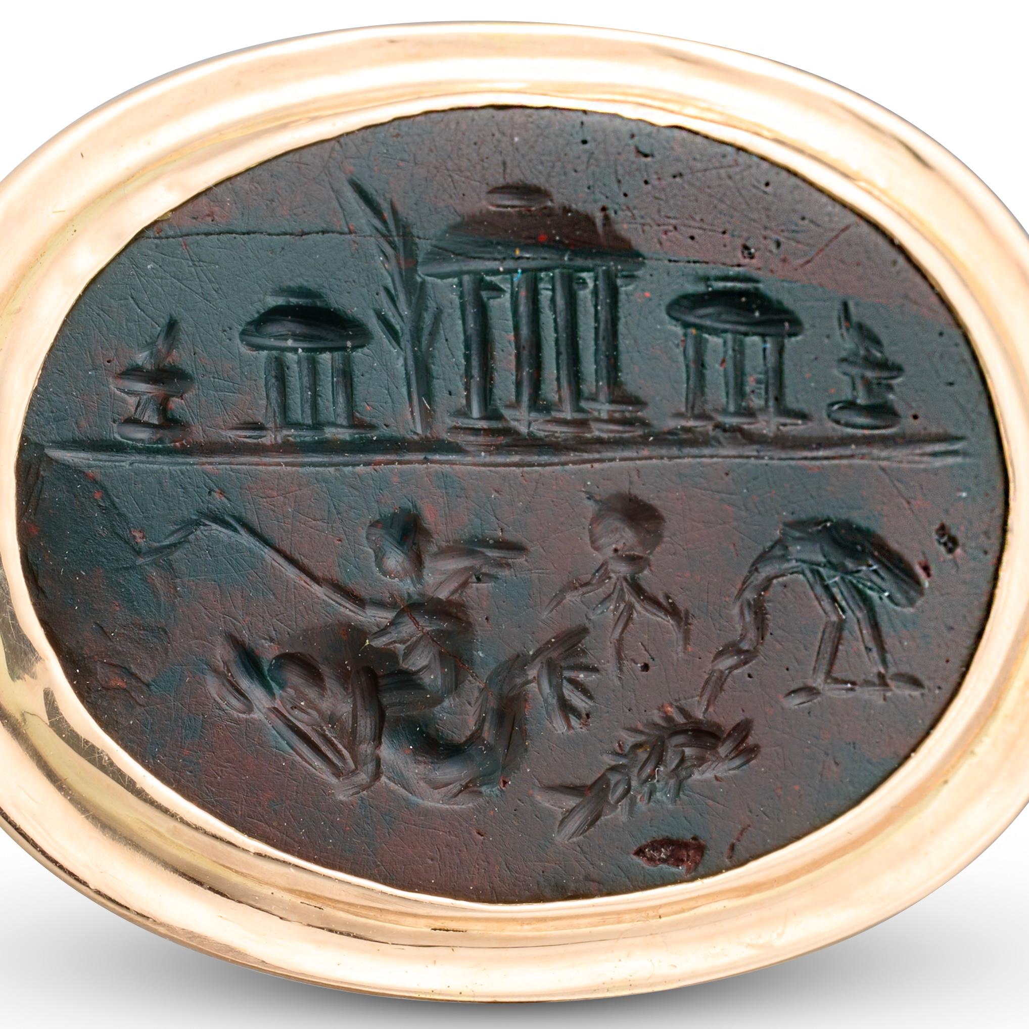 Anello in oro ad alta caratura con incastonato un diaspro magico romano.
 
Intaglio romano: I-II secolo ADS.
 
Monte: XX secolo.
 
Misure
Misura dell'anello: O UK / 7.25 US / 55 EU
Lunetta: 2,3 × 1,8 cm
Intaglio: 1,8 × 1,5 cm
Peso: 5.16 grammi
