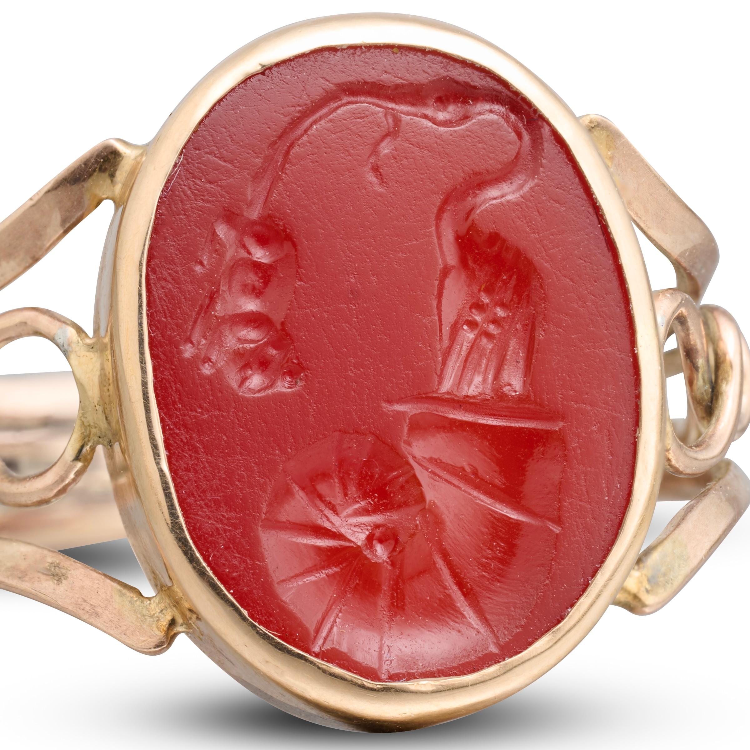 Gold Ring Set with an Ancient Roman Carnelian Intaglio Depicting a Stork Emerging from a Turbo Shell and Seizing a Mouse.

Early 19th-century gold ring set with a Roman carnelian intaglio, 1st century BC.

Measurements

    •    Ring size: UK S / US