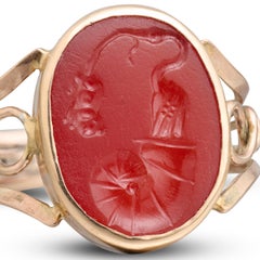 Gold ring with Ancient Roman intaglio of a stork, shell and mouse, 19th century