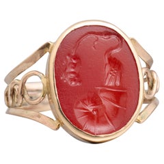 Gold ring with Ancient Roman intaglio of a stork, shell and mouse, 19th century