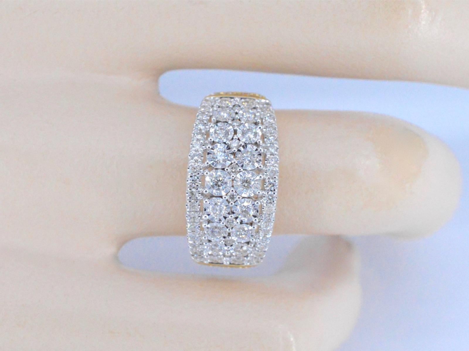 A 14K golden design ring with 1.00 carat of brilliant cut diamonds is a stunning piece of jewelry that exudes luxury and sophistication. The ring features a band made of 14K gold, which is known for its durability and timeless beauty. The design