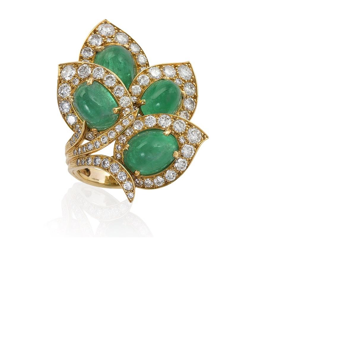A French Mid-20th Century 18 karat gold ring with diamonds and emeralds by Marchak. The leaves of this ring are framed with 81 round-cut diamonds with an approximate total weight of 5.10 carats with a VS clarity and G/H color grade. The leaves