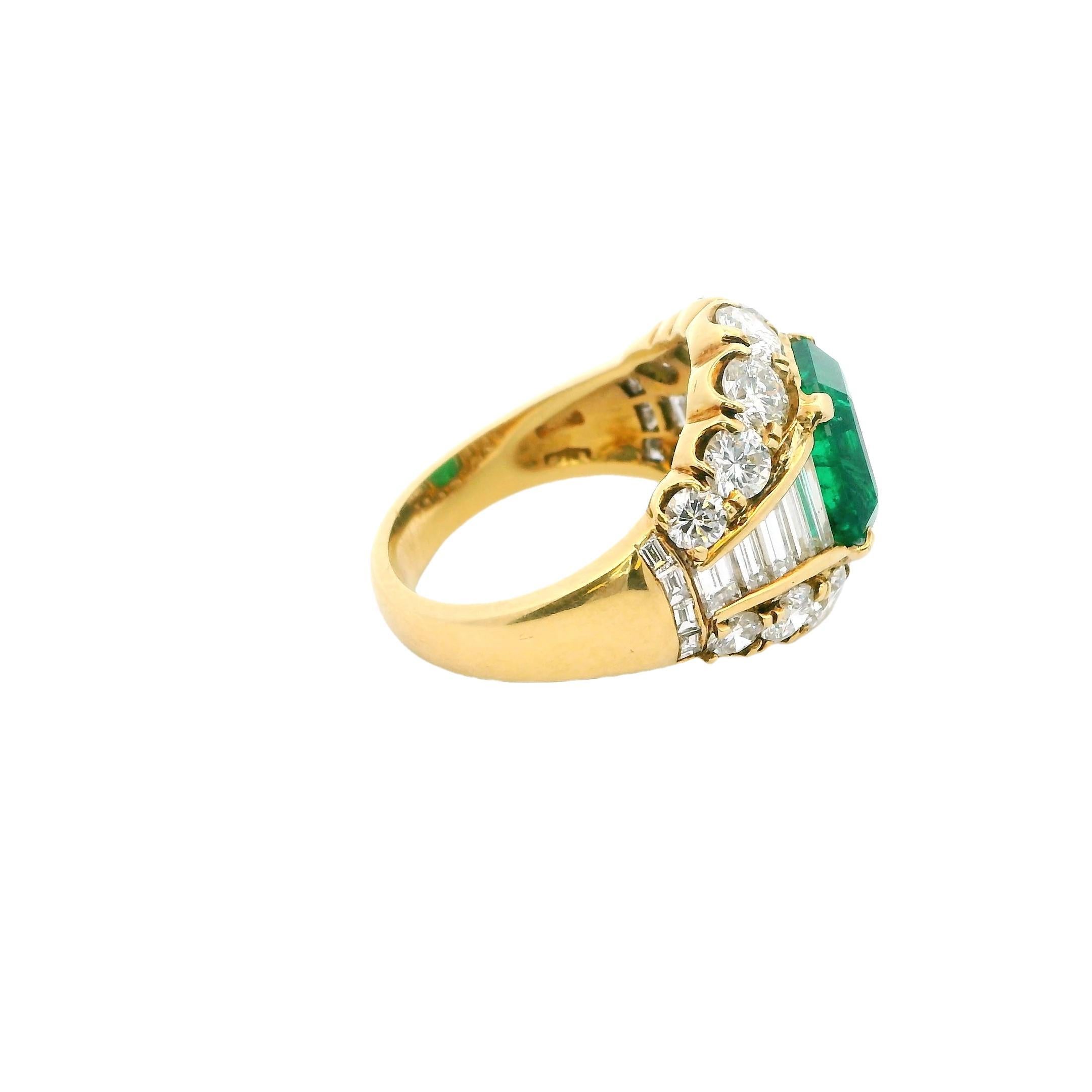 A symphony of elegance and brilliance.

This striking ring showcases a vibrant 4.11 carat emerald-cut emerald, radiating a rich green hue. The centerpiece is flanked by a dazzling array of mixed-cut diamonds, totaling 3.96 carats, with a clarity of
