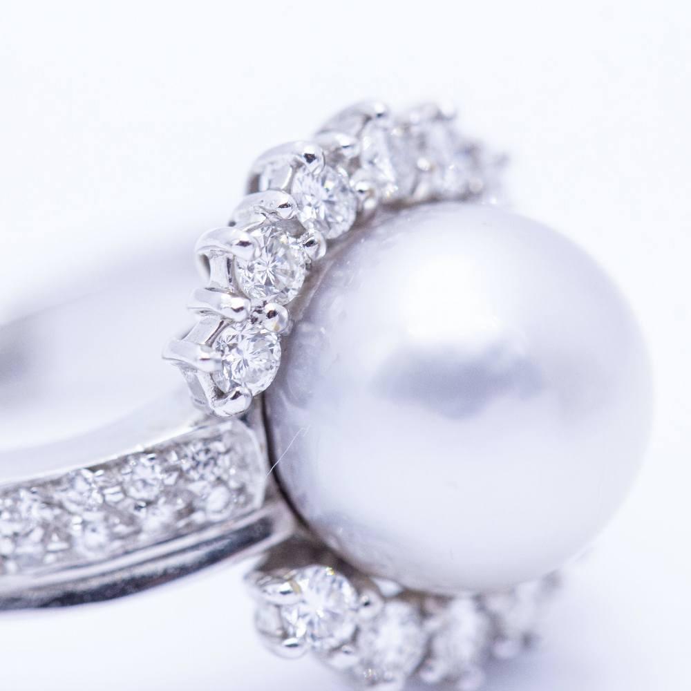 White Gold ring with natural pearl for woman  Brilliant cut diamonds with a total weight of 0.58cts. in G/VS quality  Natural cultured pearl with a diameter of 10.30mm  Size 13  18kt White Gold  9.60 grams.  Brand new product only available on the