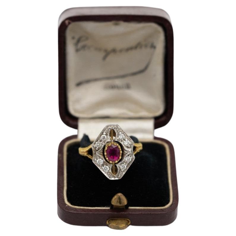 Vintage ring made of 0.750 yellow gold and a white gold element.

Ring set with a natural ruby weighing 0.35ct and 8 diamonds weighing 0.16ct (color H-J, clarity SI-I2)

The ring is in very good condition

The purchase is accompanied by a jewelry