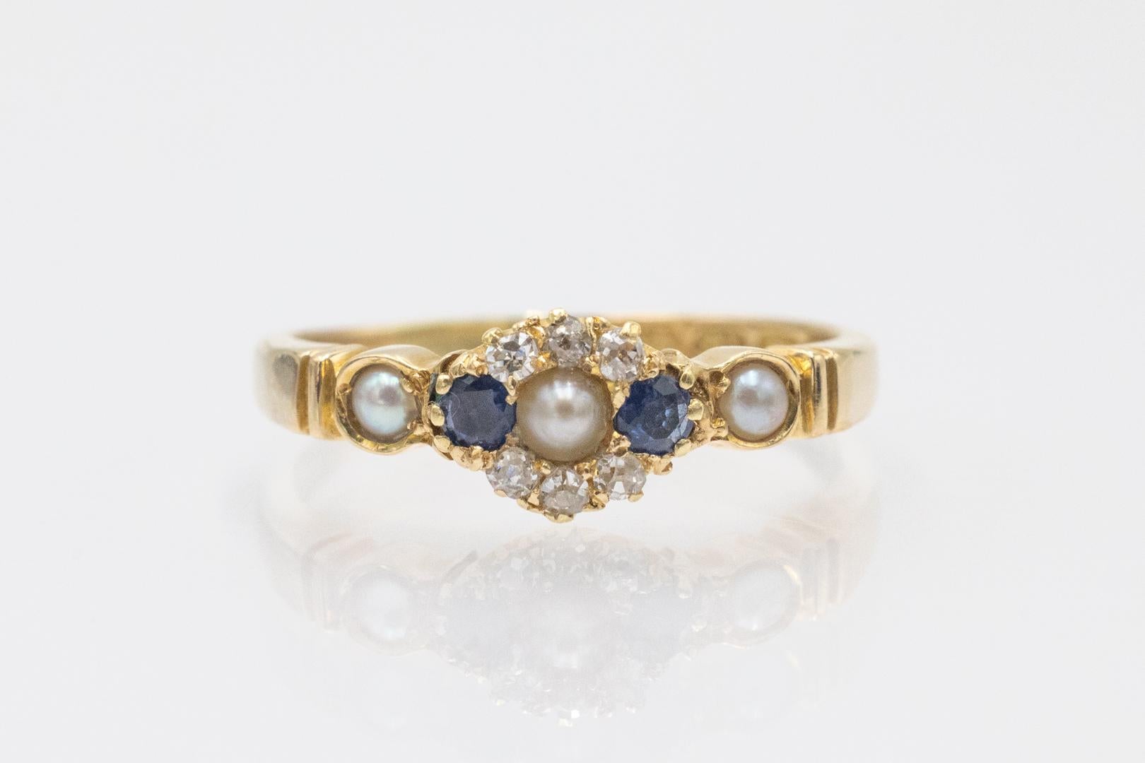 Gold ring with sapphires, pearls and diamonds, Great Britain 1930s.

A unique ring made of 18-karat yellow gold (0.750 fineness). The ring is decorated with two sapphires and three natural pearls. Additionally, the ring is set with 6 diamonds in an