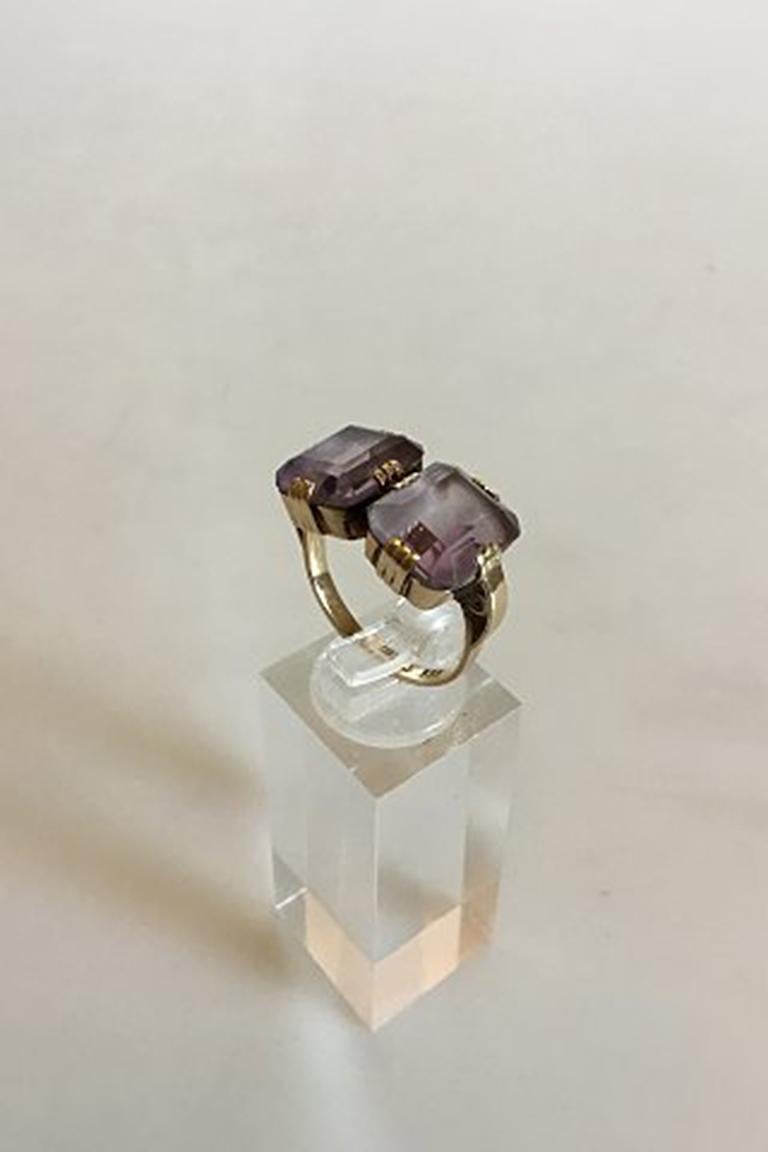 Gold ring with two Amethysts. 14 K. Ring Size 54 / 6 3/4. Weighs 6.65 g / 0.24. Stamped 585 Fønss (Svend Fønss)