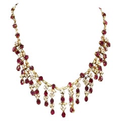 Halskette aus 14 Karat Gelbgold mit Rubin und Diamanten und Fransen