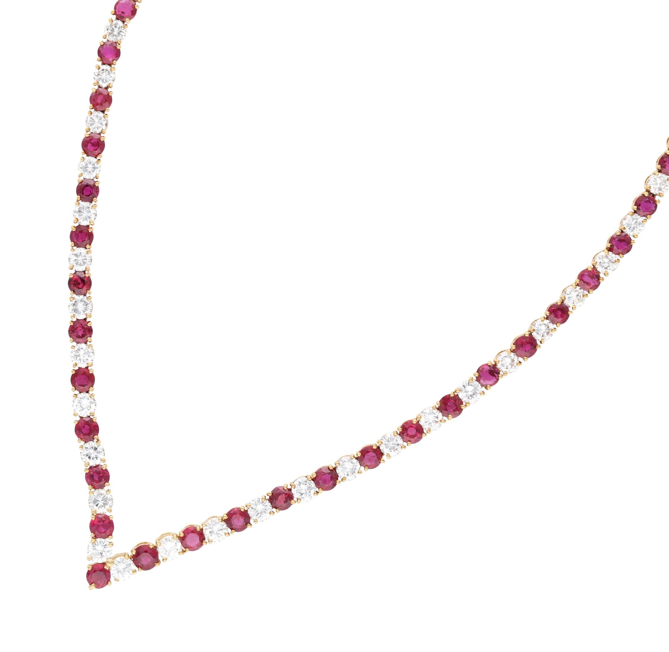 Composed of graduated 52 round rubies and 52 round brilliant cut diamonds.

- Round brilliant cut diamonds weigh a total of approximately 10.70 carats
- Round rubies weigh a total of approximately 14.15 carats
- 14 karat yellow gold
- Total weight