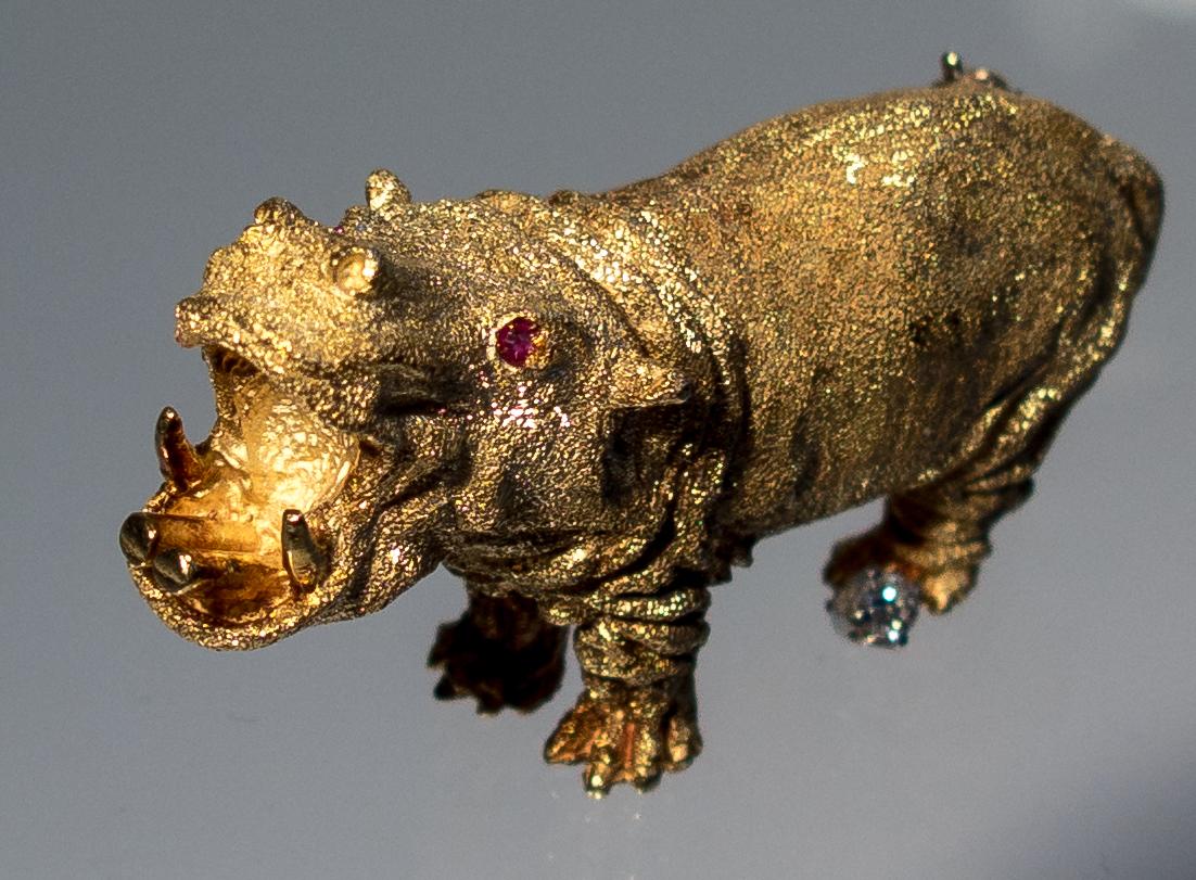 We're not exactly sure wherein lies the appeal of a hippo jewel, but we were charmed by this little guy when we first saw him.   He has sparkly red ruby eyes, a small diamond lodged between his toes, and a roar you can almost hear coming from his