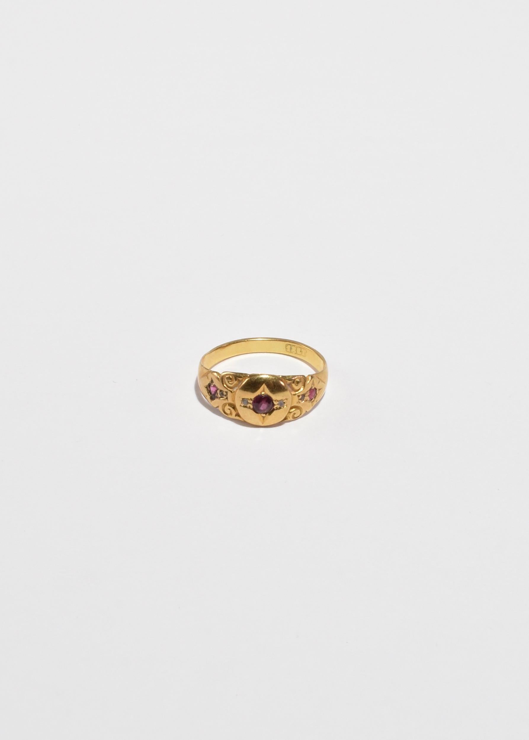 Vintage gold ring with ornate detail and faceted ruby and diamond stones. Stamped 18k.

Material: 18k gold, ruby, diamond.

We recommend storing in a dry place and periodic polishing with a cloth.