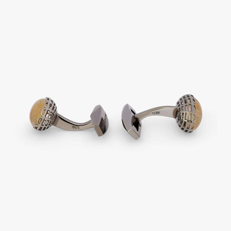 Gold Rutilated Quartz Rhodium Plated Sterling Silver Cufflinks, Limited Edition

Rutilated quartz is created when needle-like inclusions of rutile form within a quartz stone to create star-like patterns. These limited edition cufflinks feature